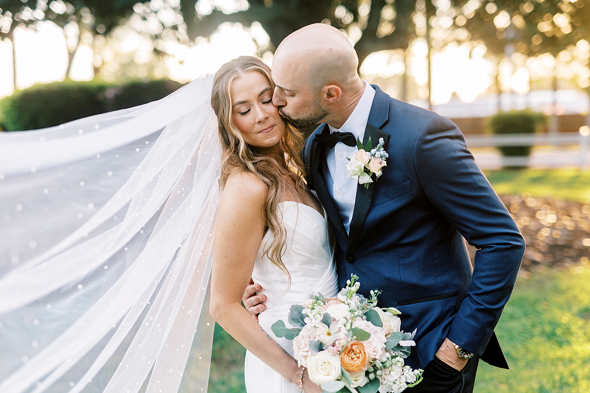 groom kisses bride