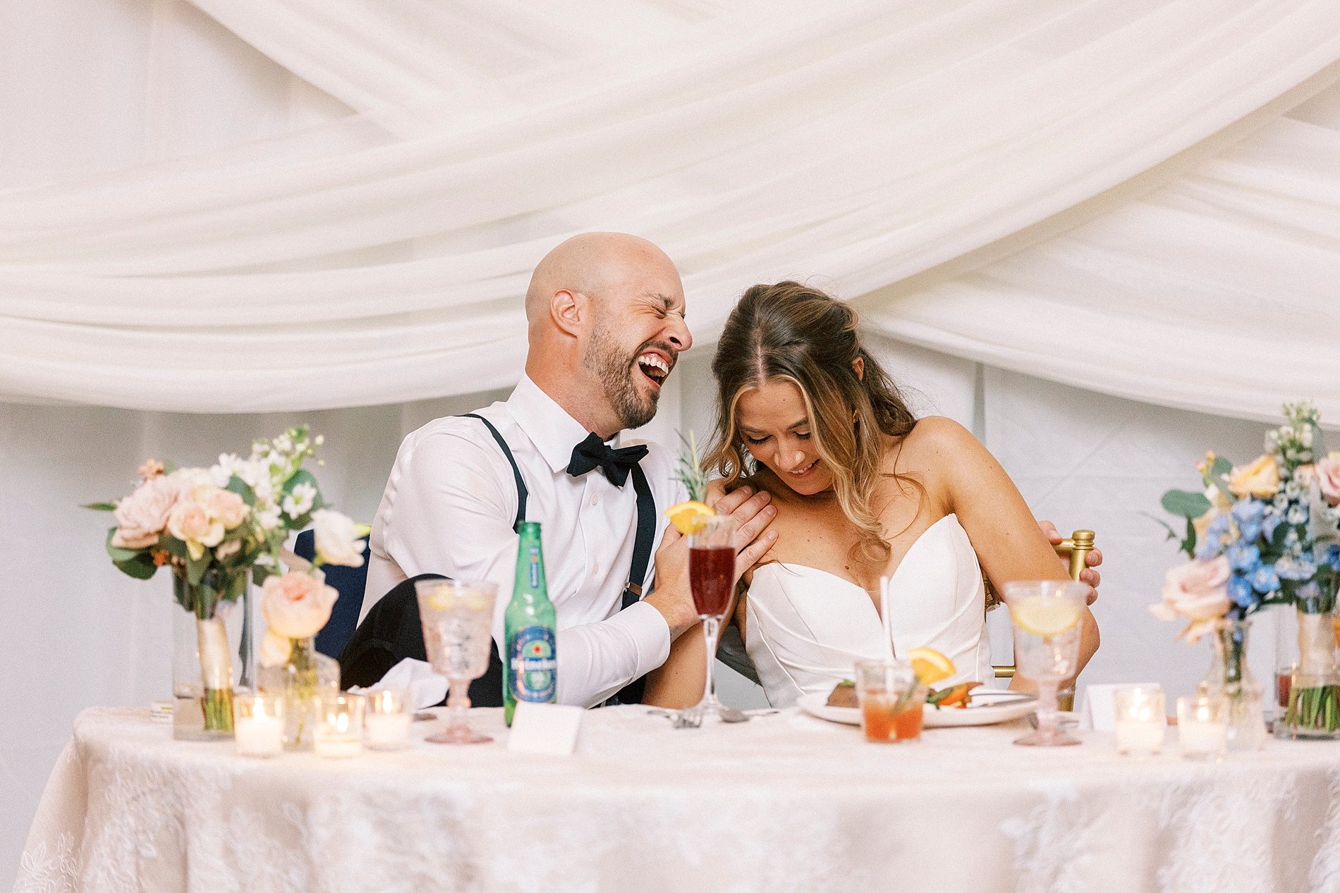 candid portraits of newlyweds laughing