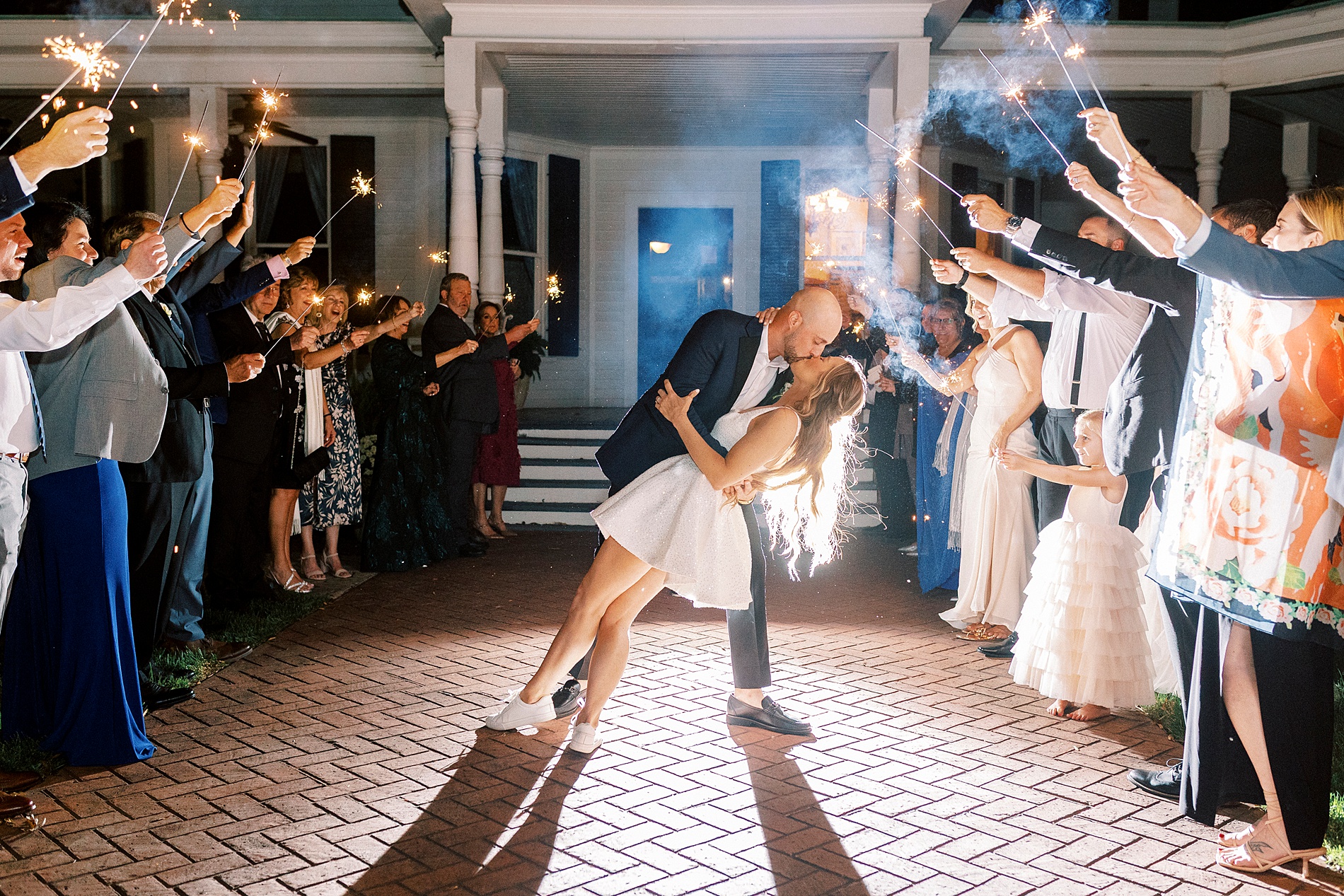 newlyweds kiss during sparkler exit
