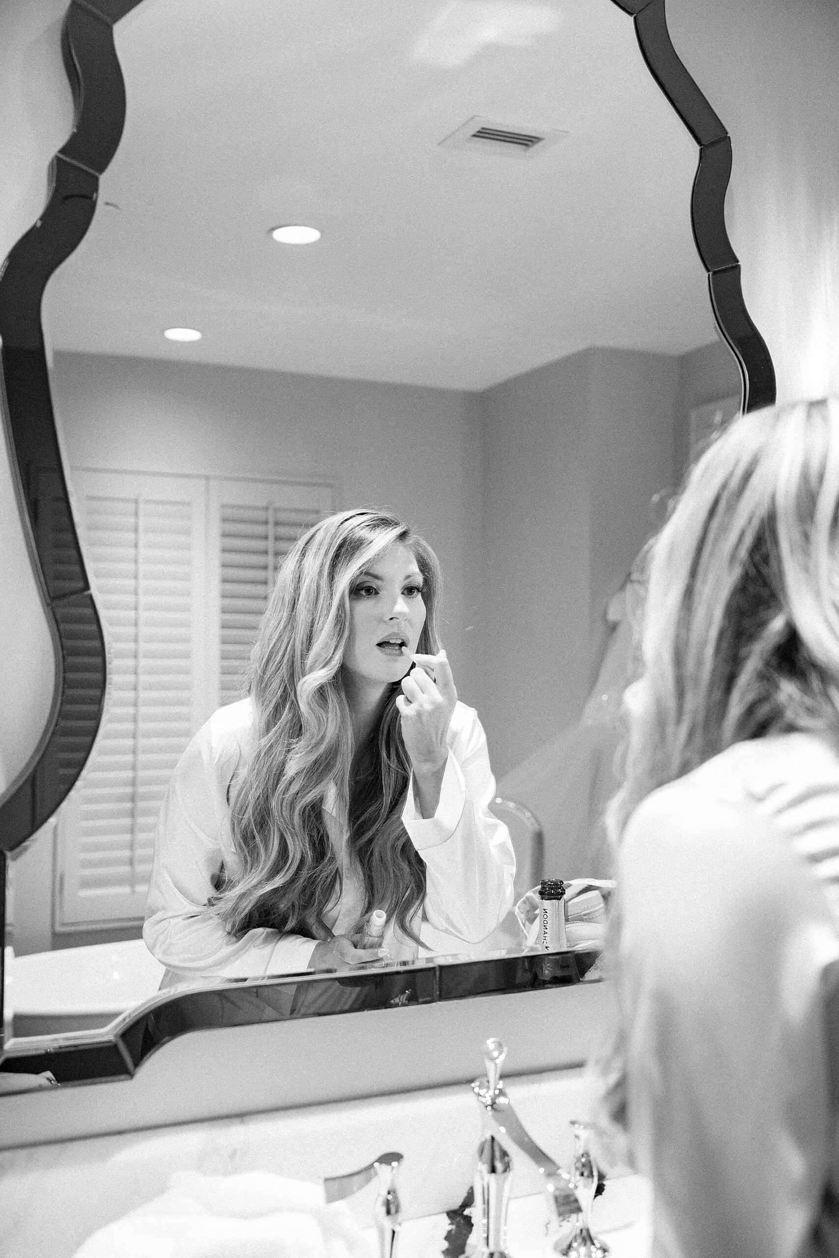 bride puts on lipstick 