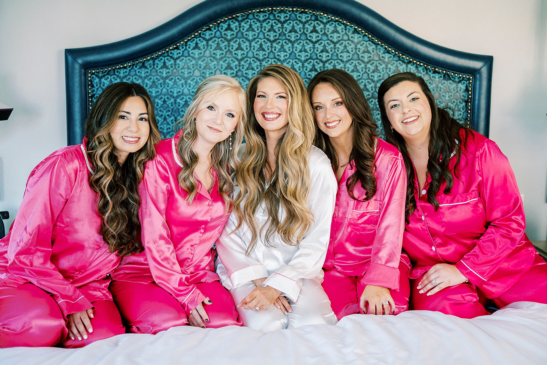 bride with bridesmaids in pink pjs 