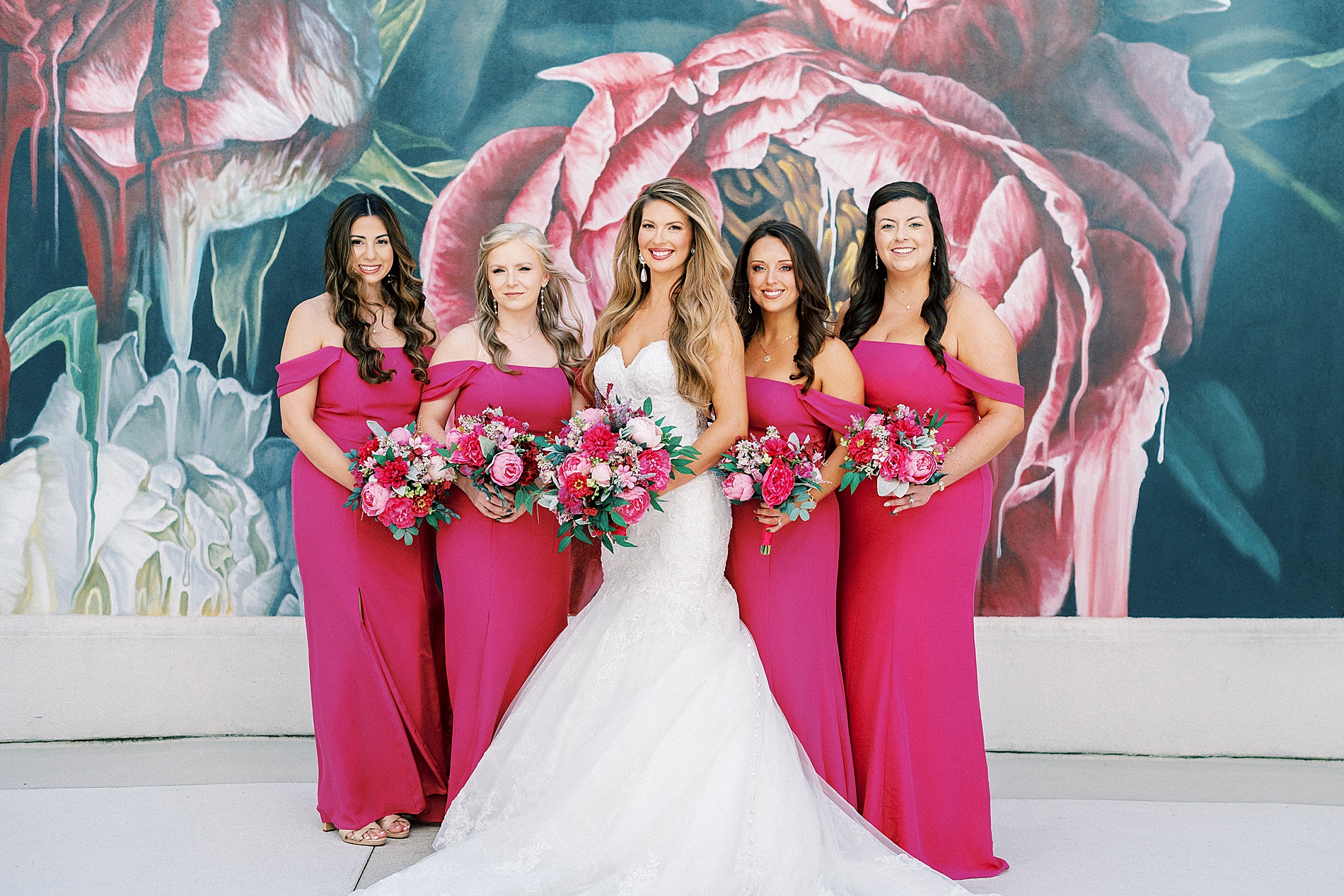 bride with bridesmaids in vibrant pink dresses from The Grand Bohemian Hotel Wedding  