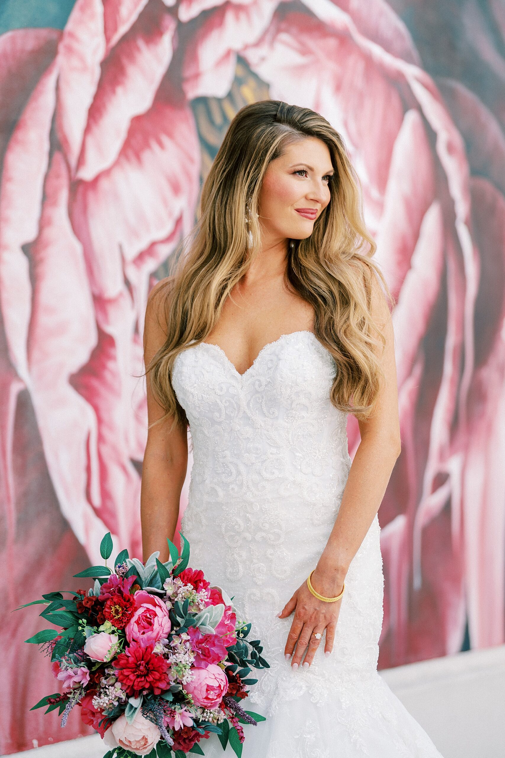 bride holding pink bouquet 