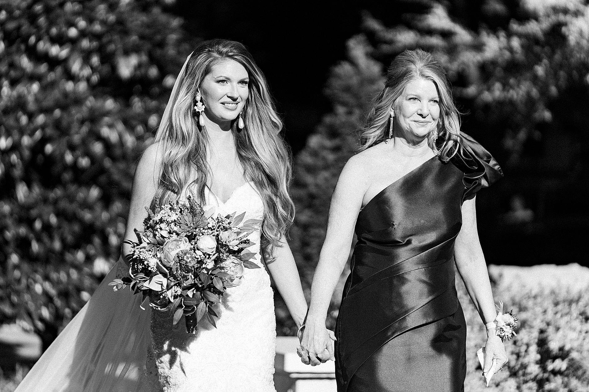 mom walks with daughter down the aisle 