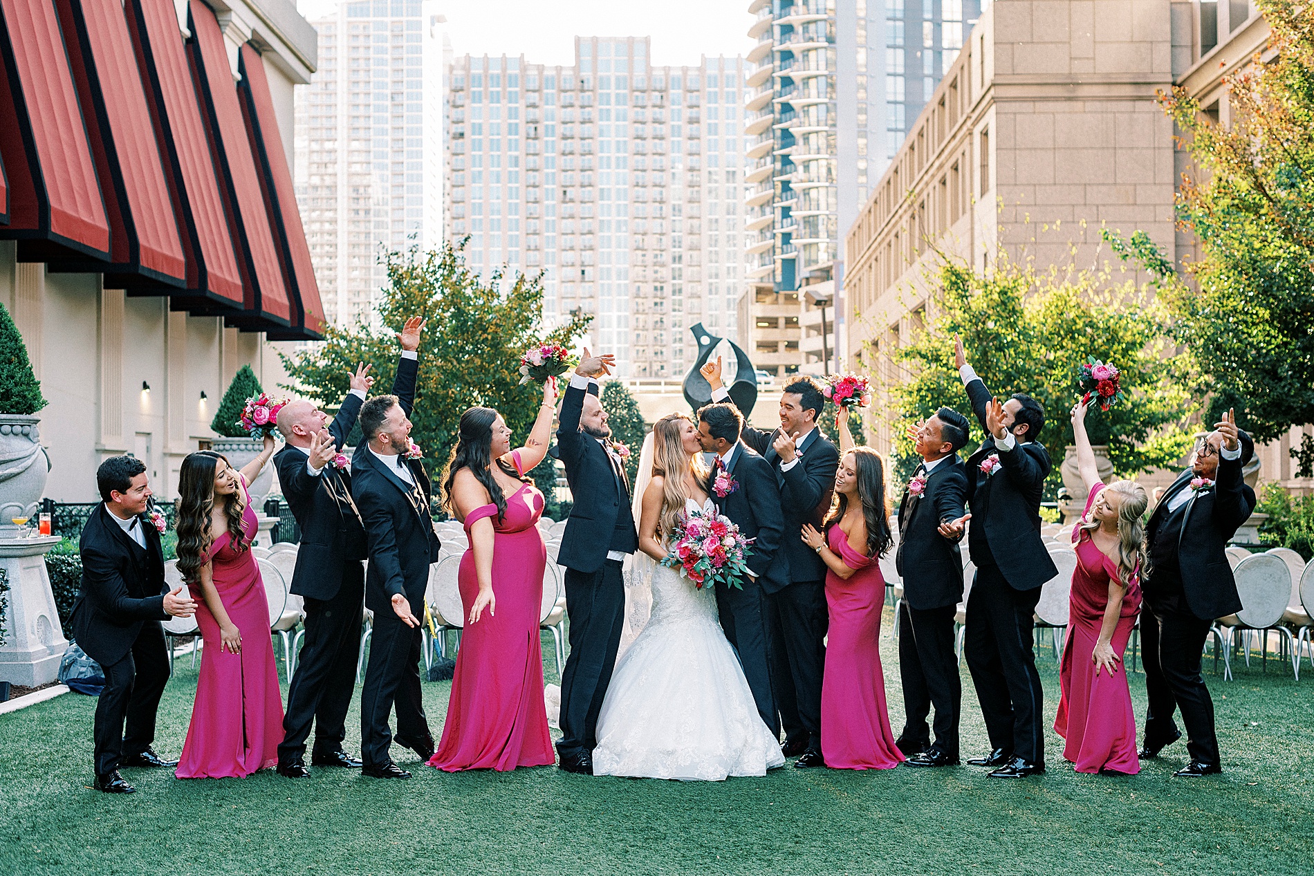 wedding party portraits with bridesmaids in magenta dresses and groomsmen in tuxes