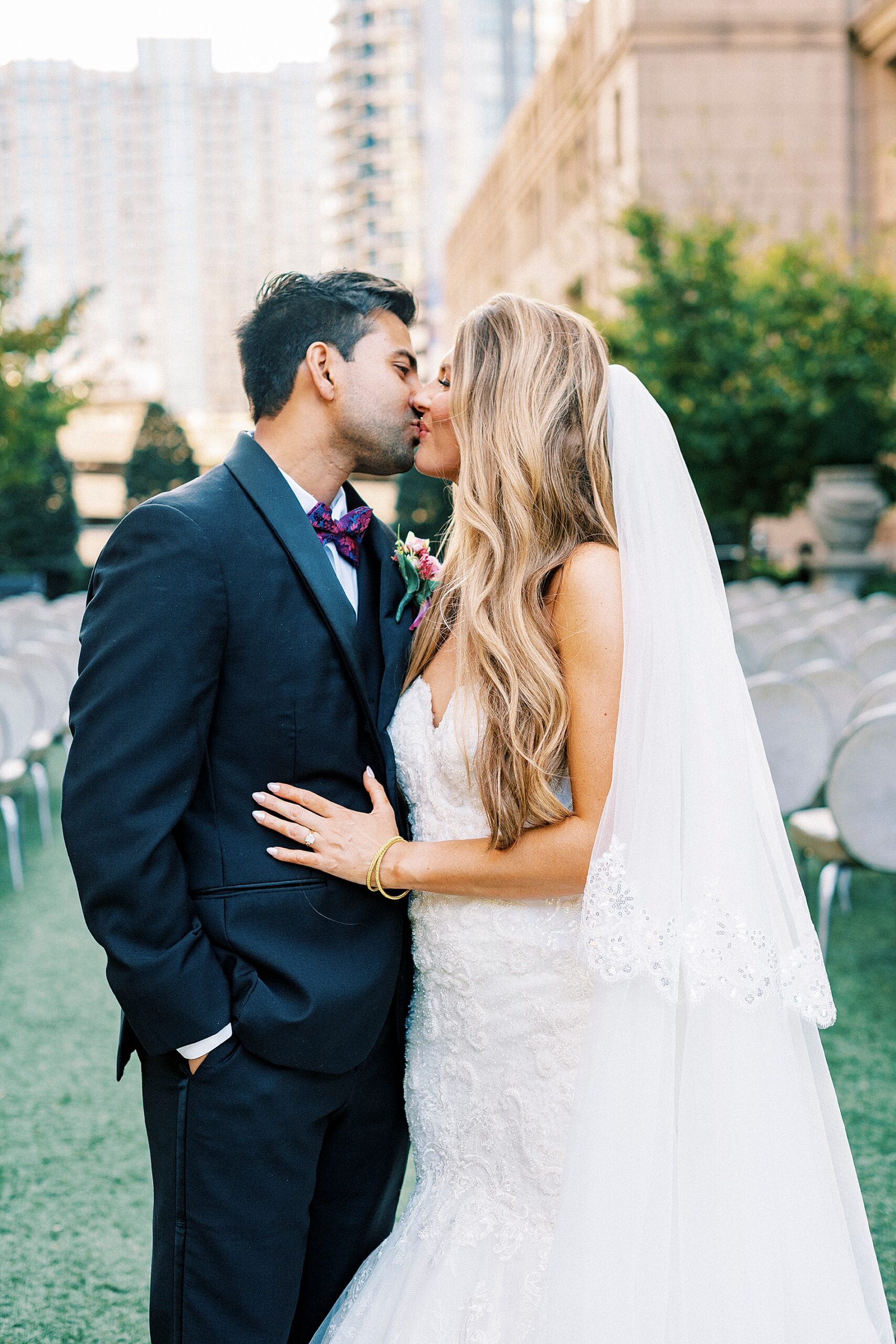 couple kiss on rooftop at The Grand Bohemian Hotel  