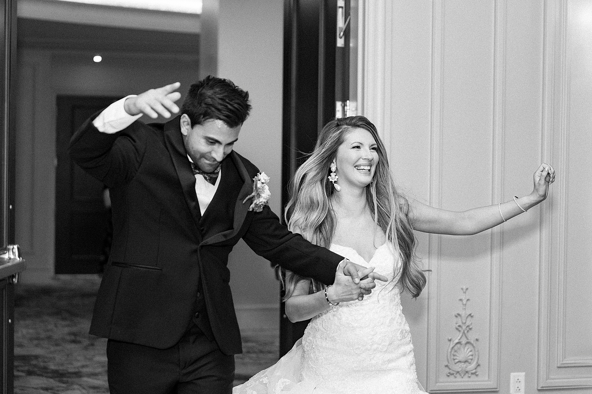 bride and groom enter wedding reception 