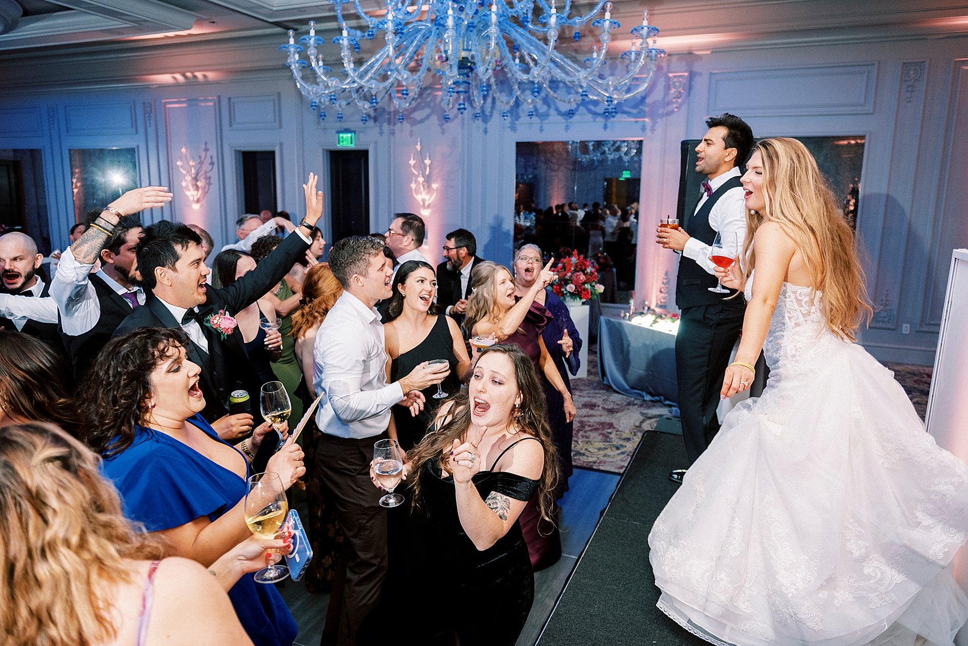 newlyweds on stage of wedding reception 