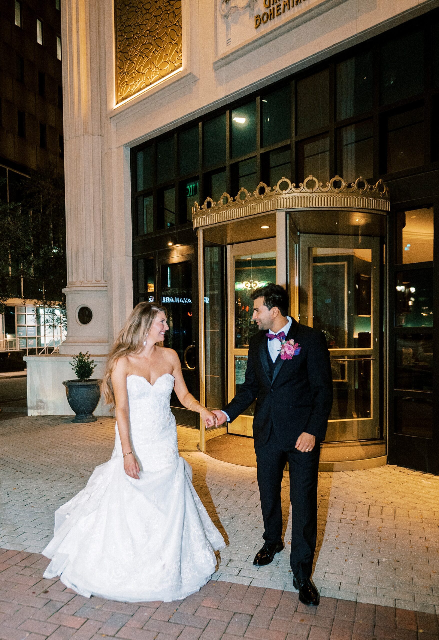 bride and groom outside of the The Grand Bohemian Hotel in Uptown Charlotte, NC