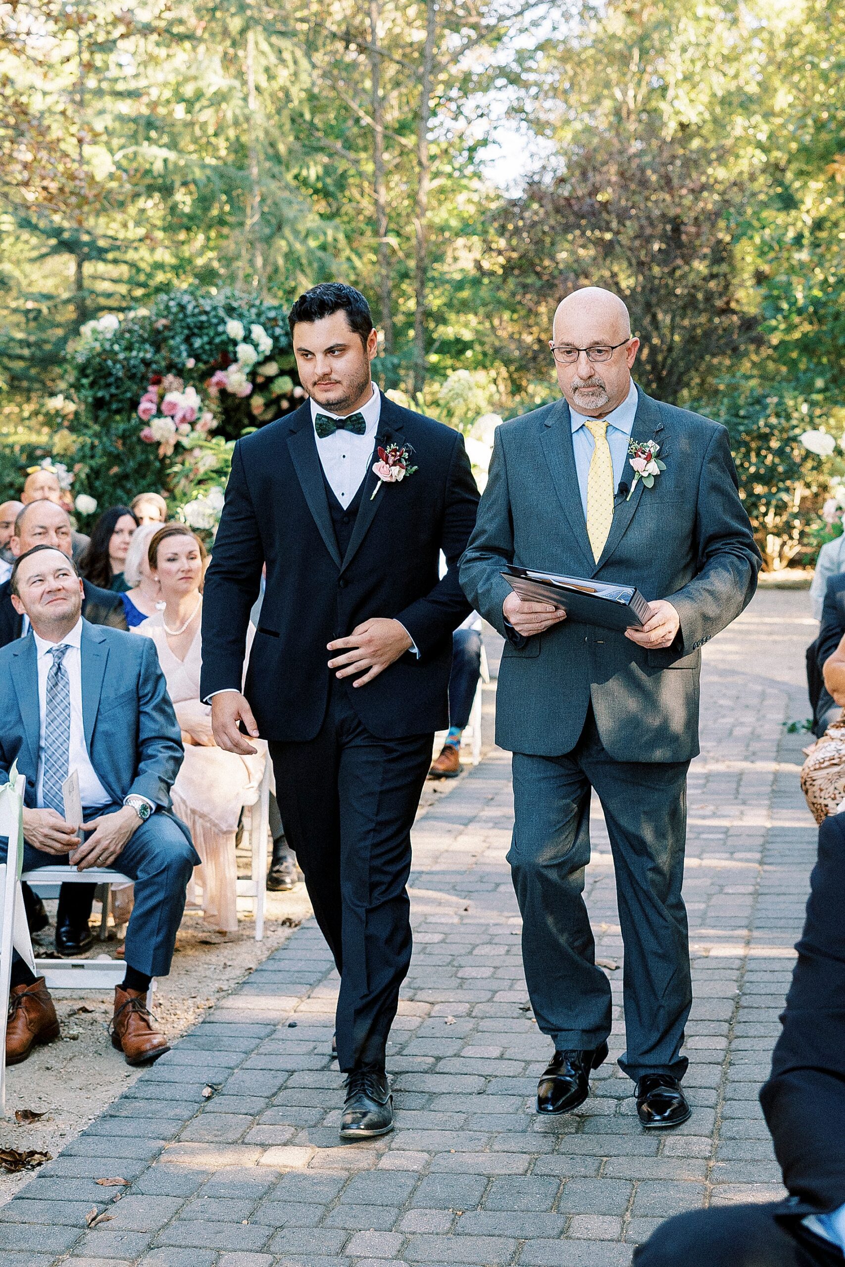 groom walks down aisle 