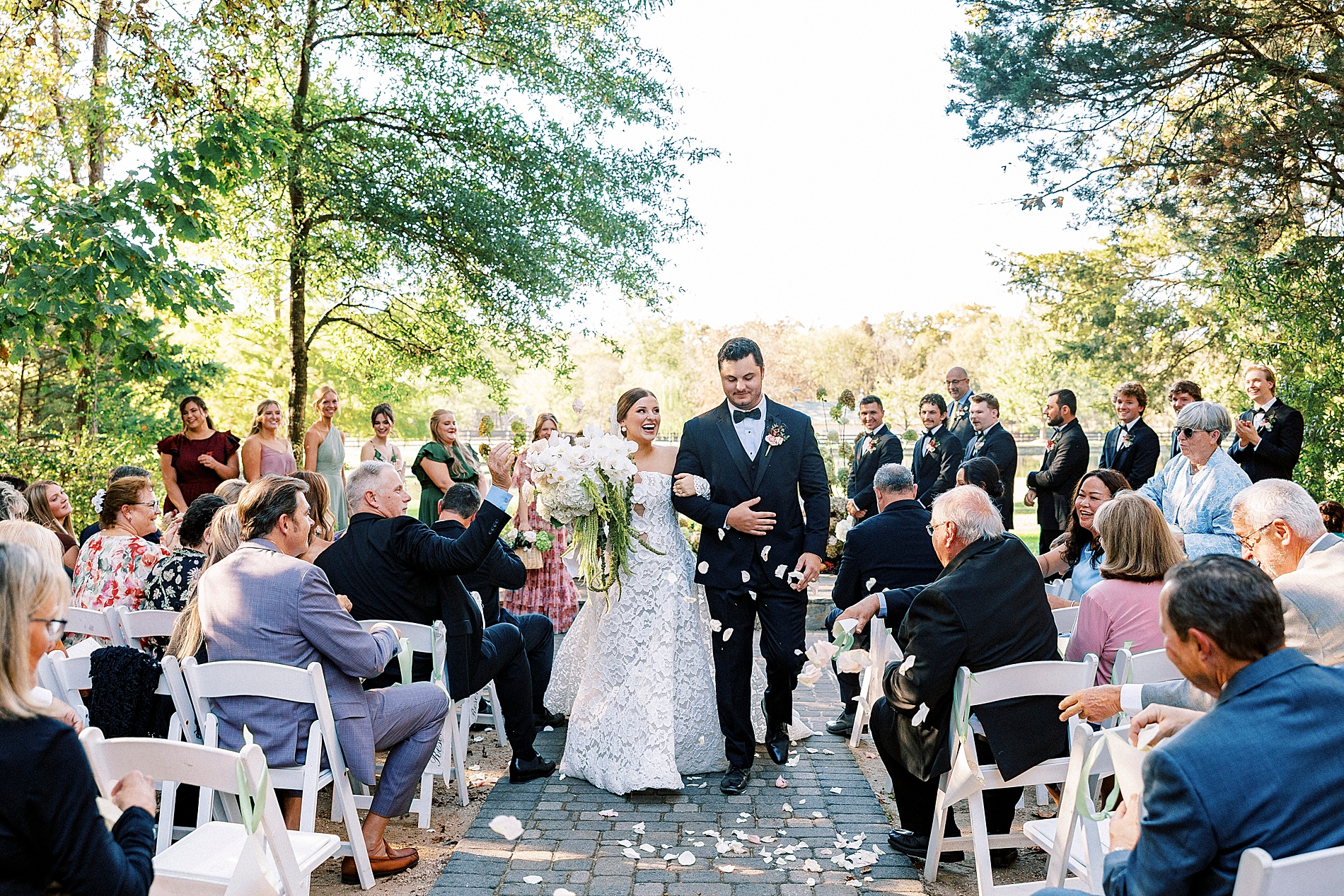 newlyweds walk down wedding aisle 
