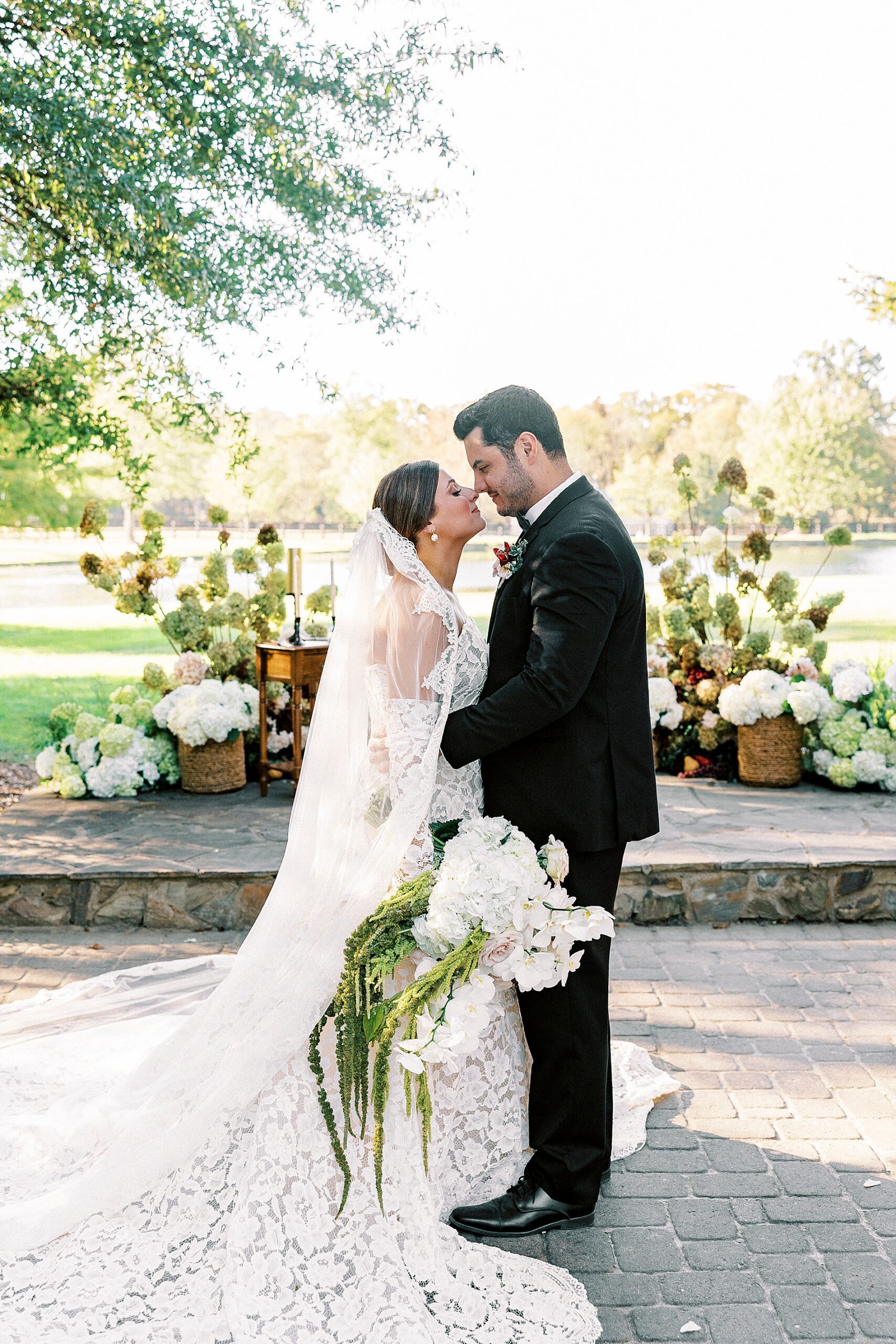 newlyweds portraits with beautiful organic florals in the background 