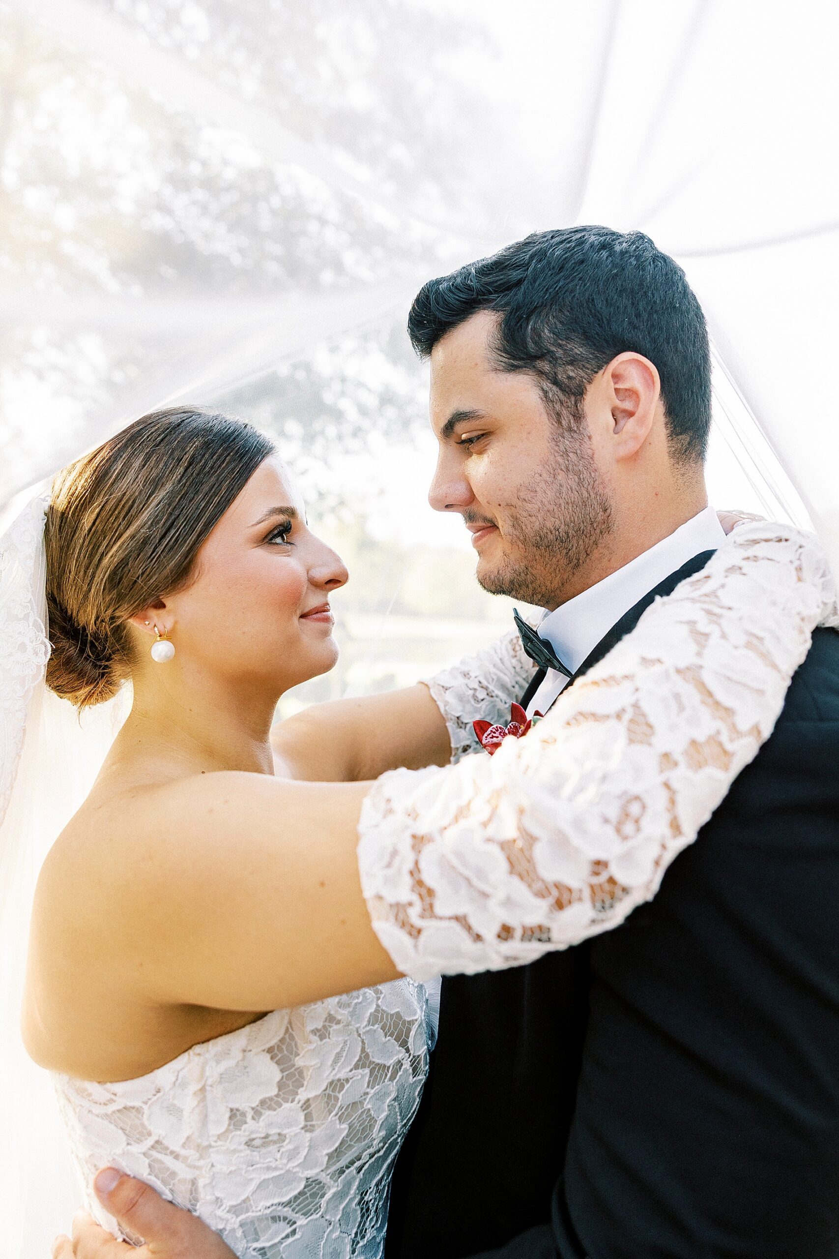 bride and groom portraits under bride's veil 