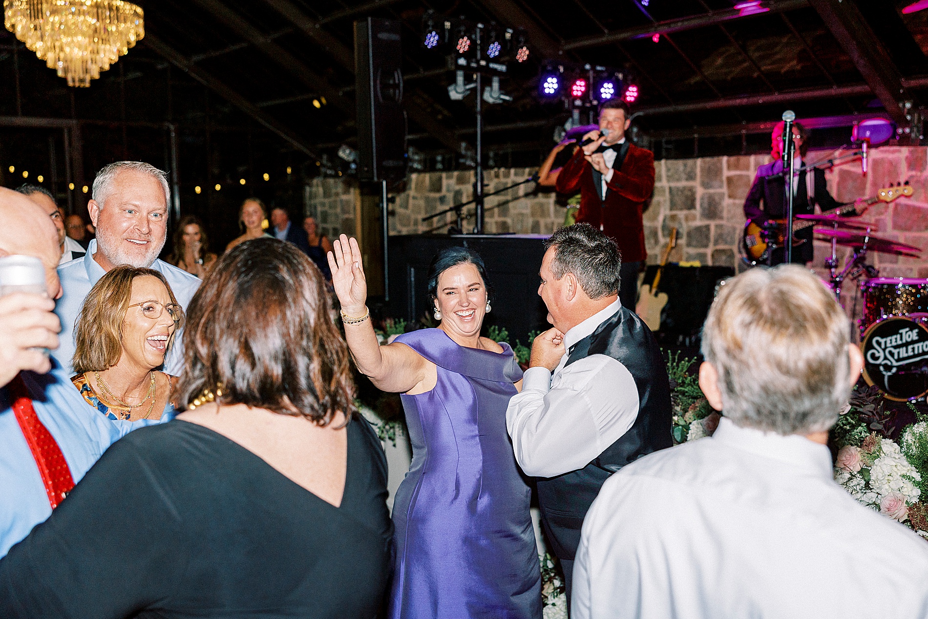 wedding guests on dance floor 