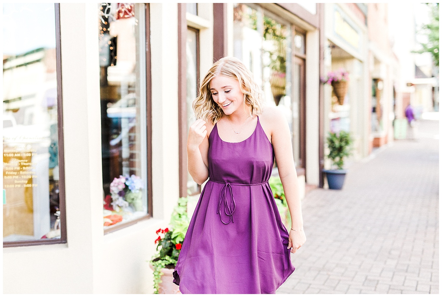 senior girl in purple dress downtown concord north carolina
