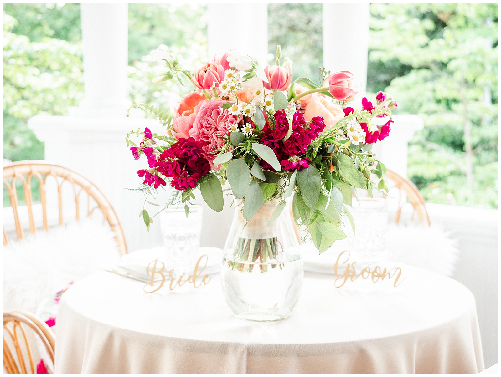 Enchanting white table setting and bright floral centerpiece from Boho Chic Summer Wedding in Charlotte, NC | check out the full wedding at KevynDixonPhoto.com 