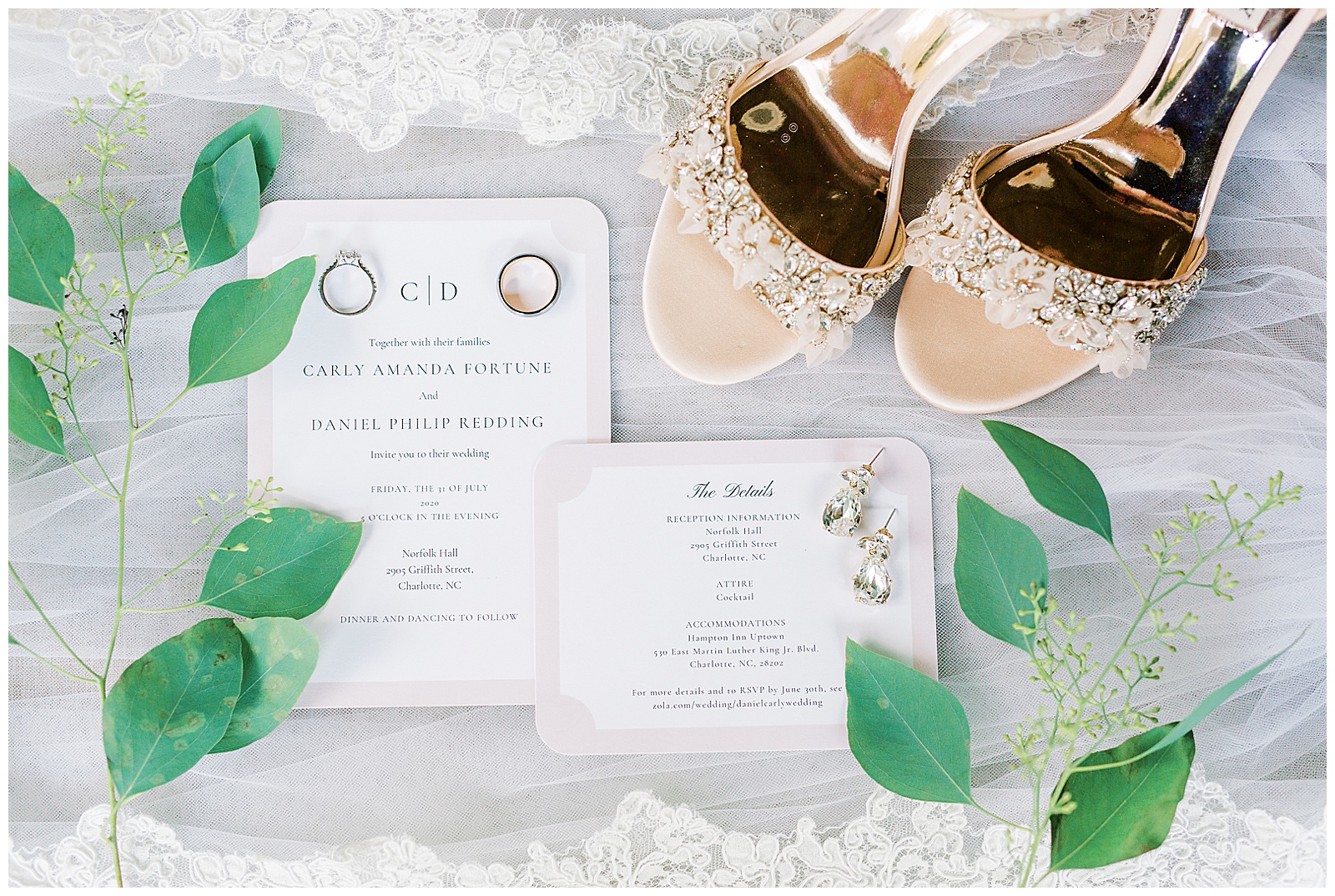 Invitation Suite framed by bright green leaves and gold heels