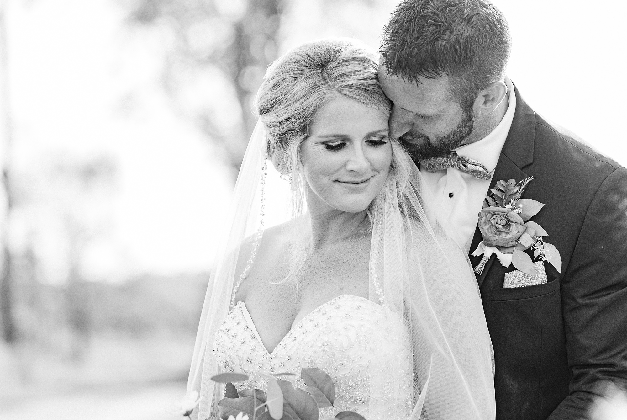 black and white portrait of bride and groom on wedding day