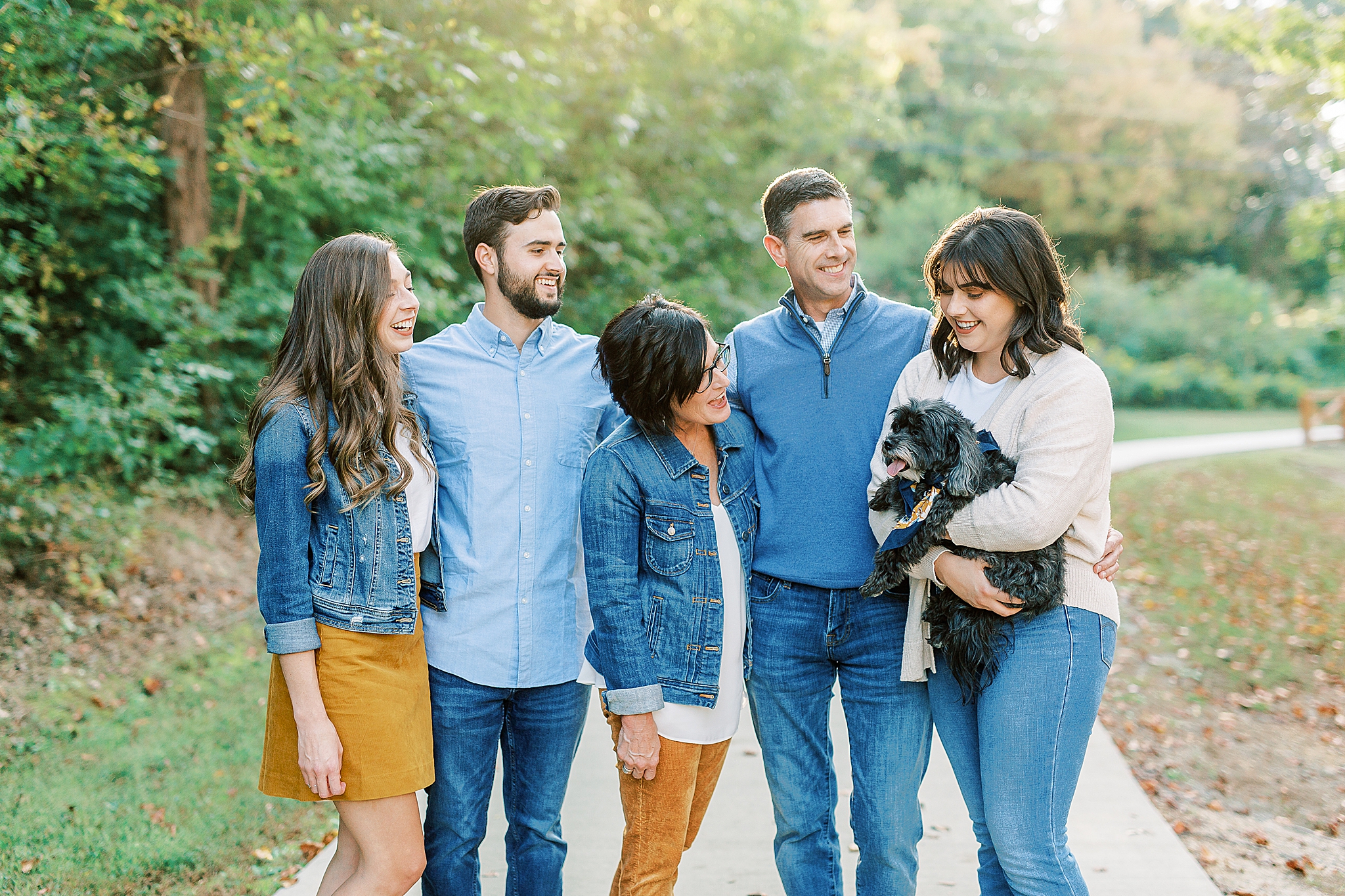family poses with dog during Pharr Mill Park family photos