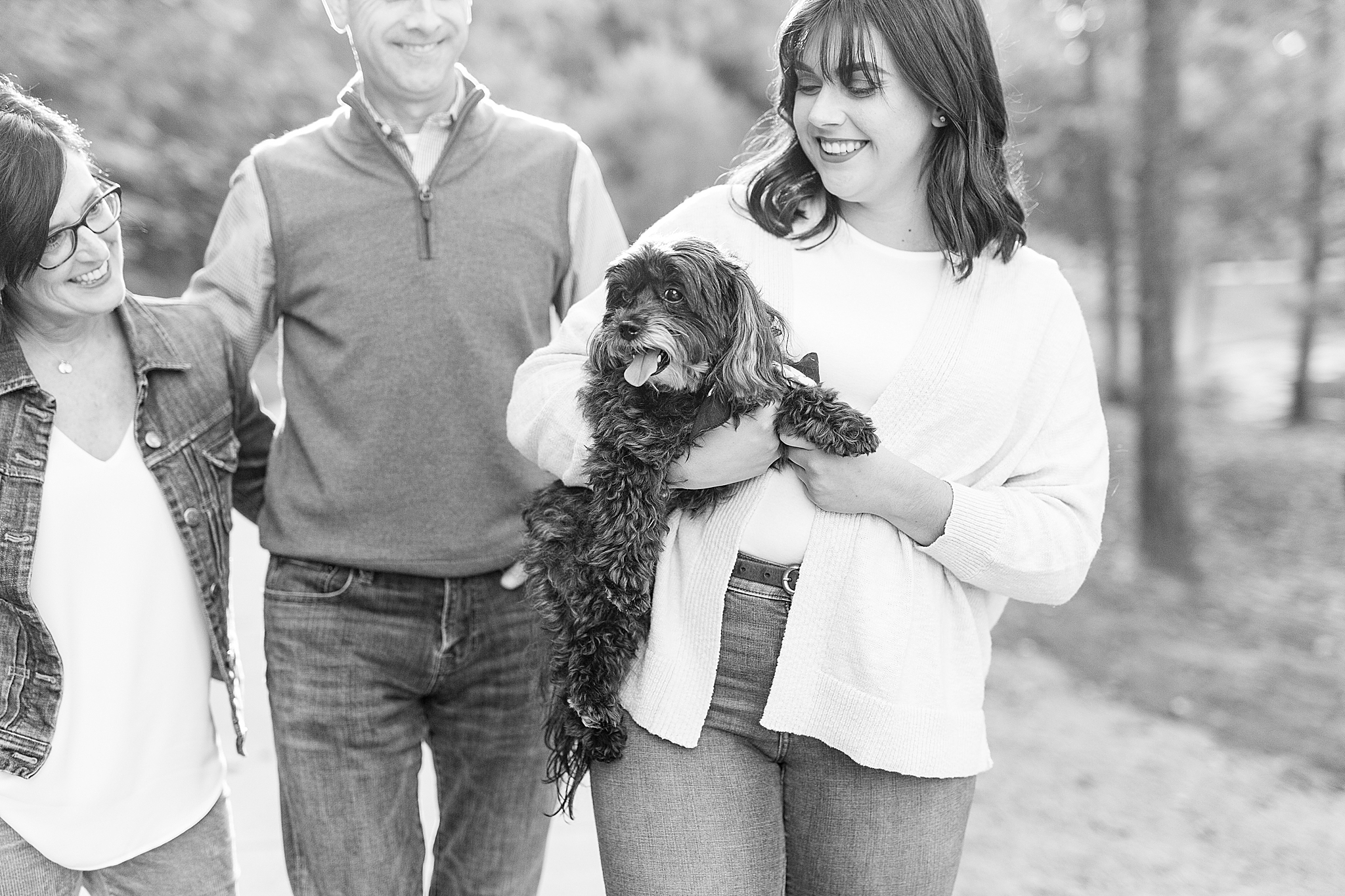 daughter holds dog during NC family photos