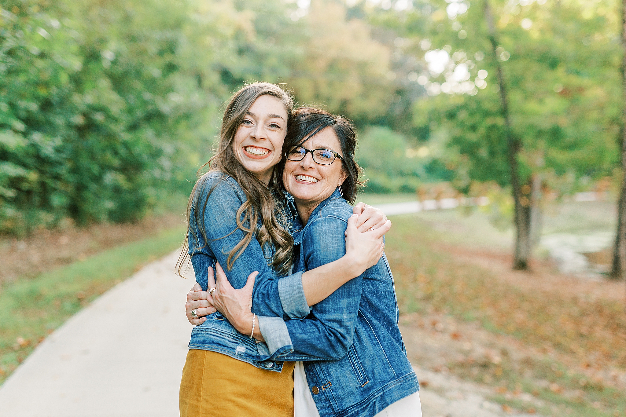 mom hugs daughter during NC family photos