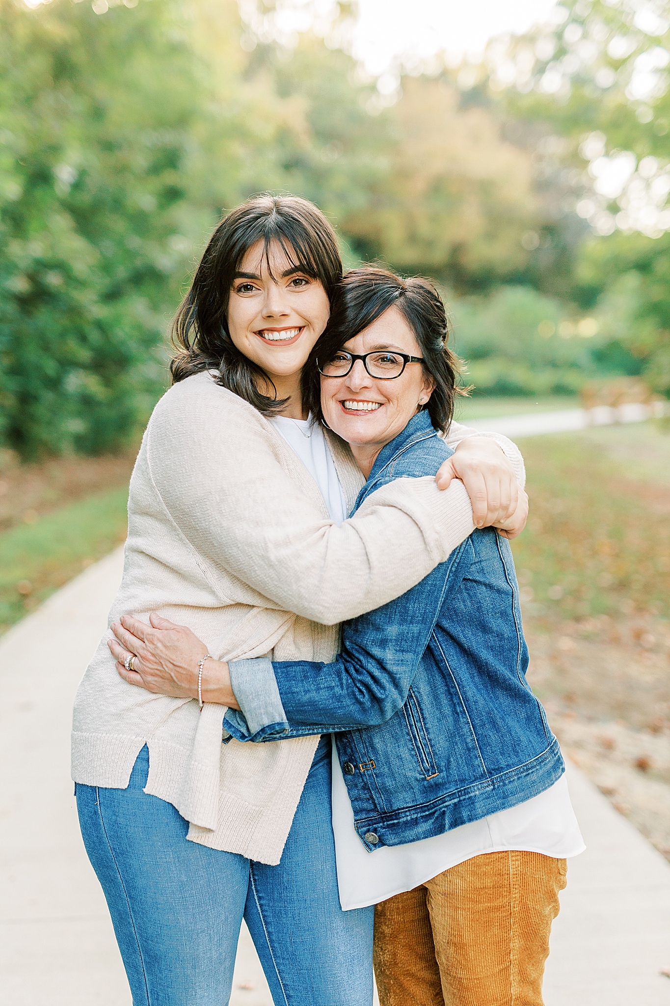 mom hugs daughter during Charlotte Fall Family Portraits