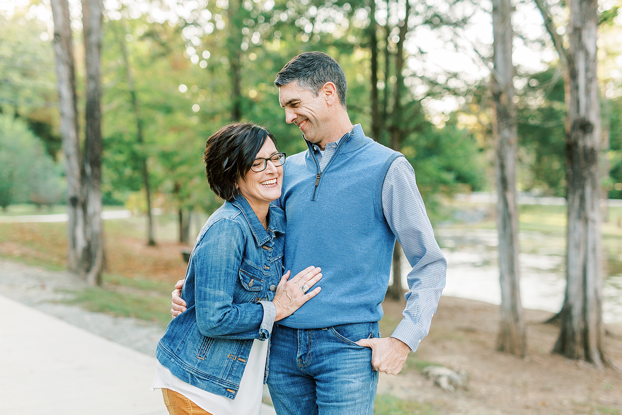 husband and wife laugh during NC family photos