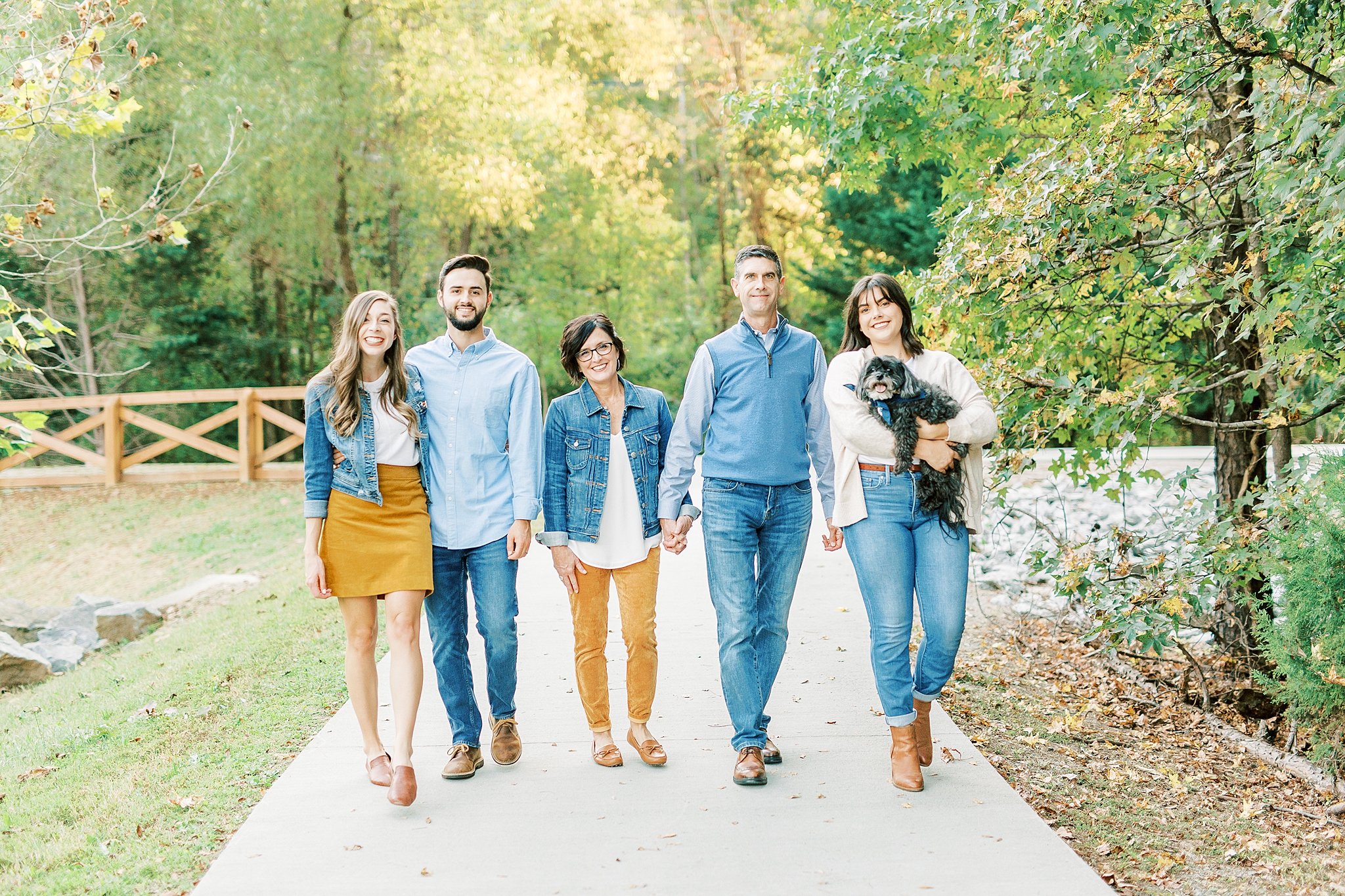 family walks during Fall family portraits in Pharr Mill Park