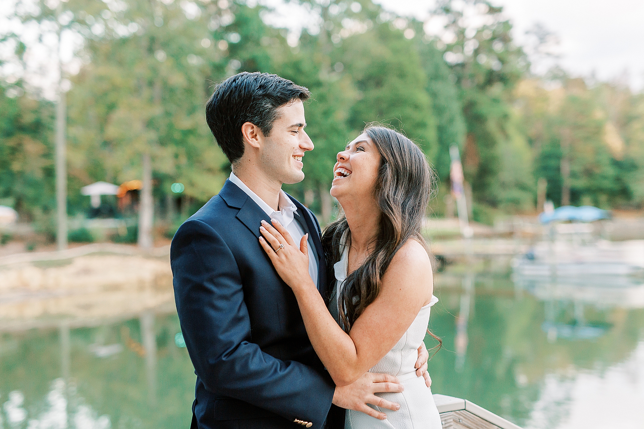 Charlotte NC couple laughs during rehearsal dinner