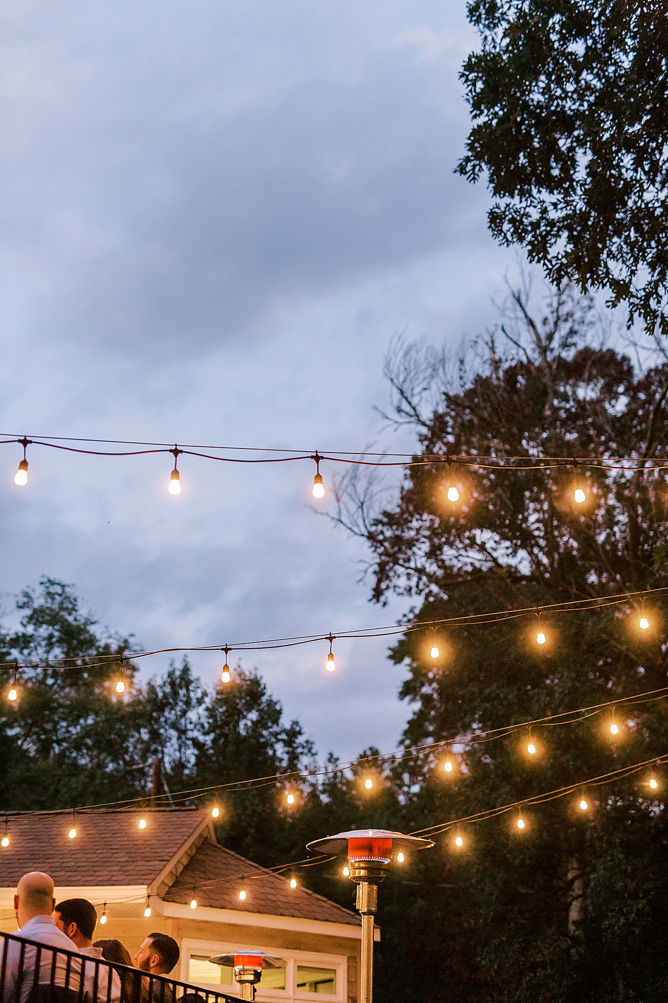 Charlotte NC Rehearsal Dinner with string lights and vintage tablewear