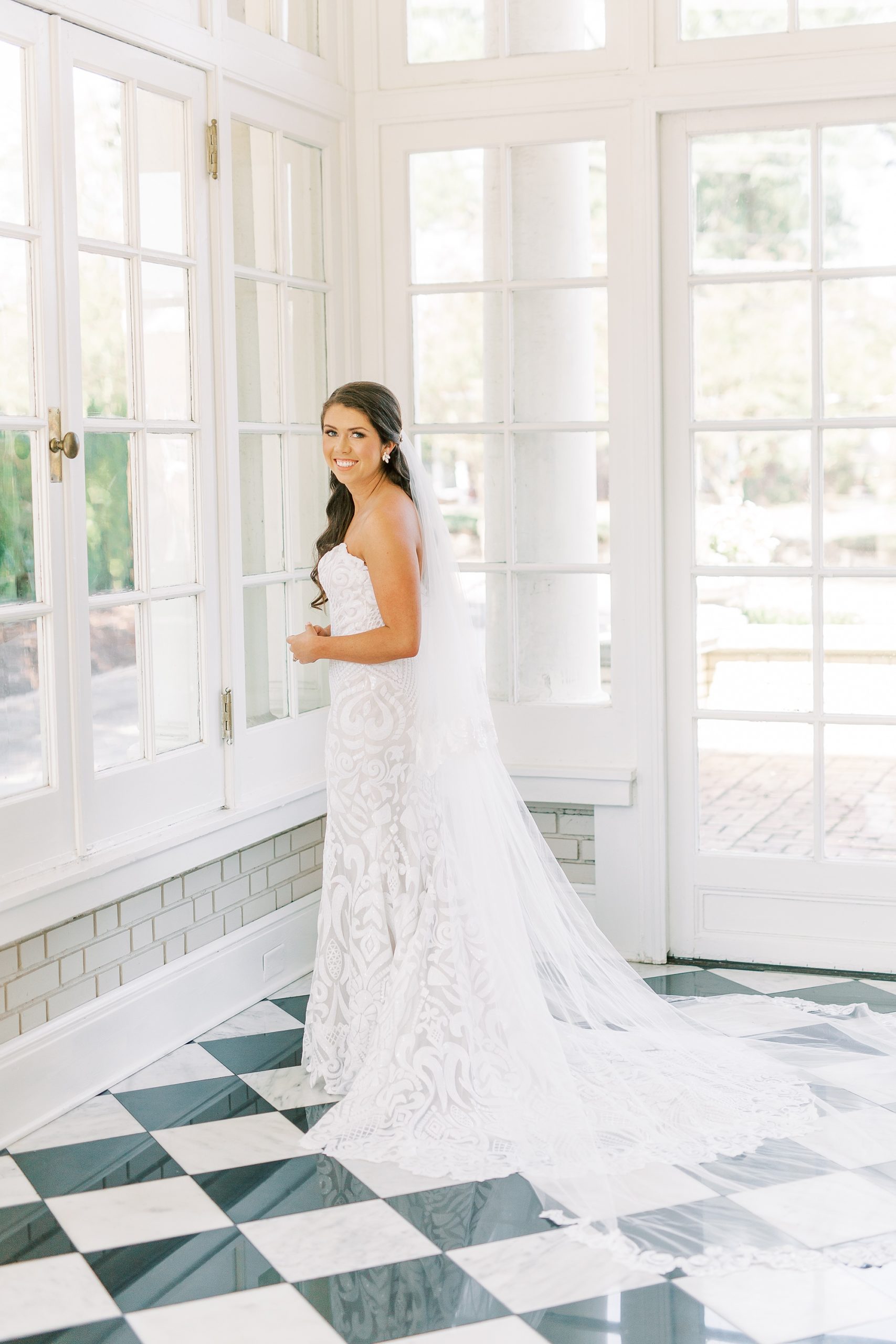 bride looks out window at Separk Mansion