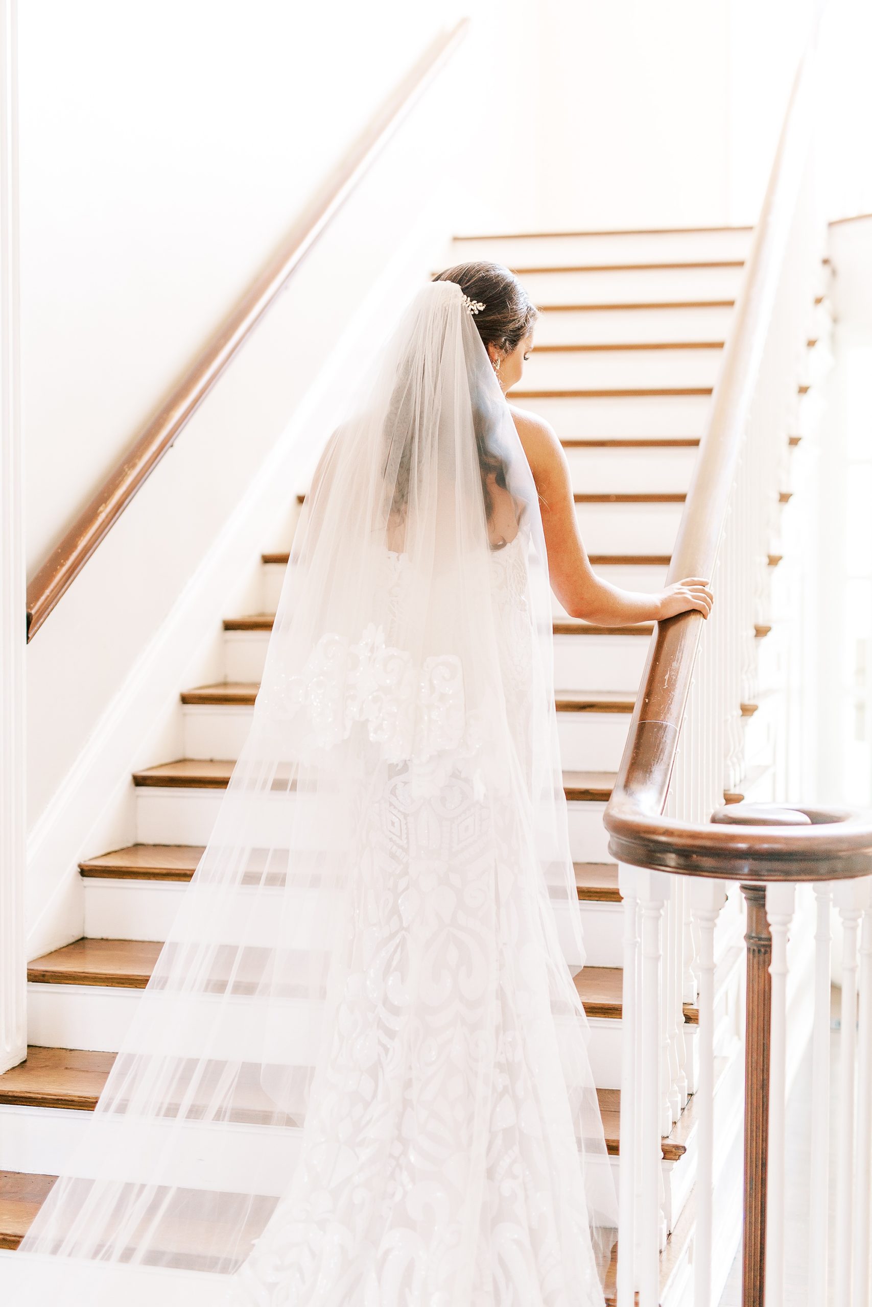 bride poses on staircase at Separk Mansion