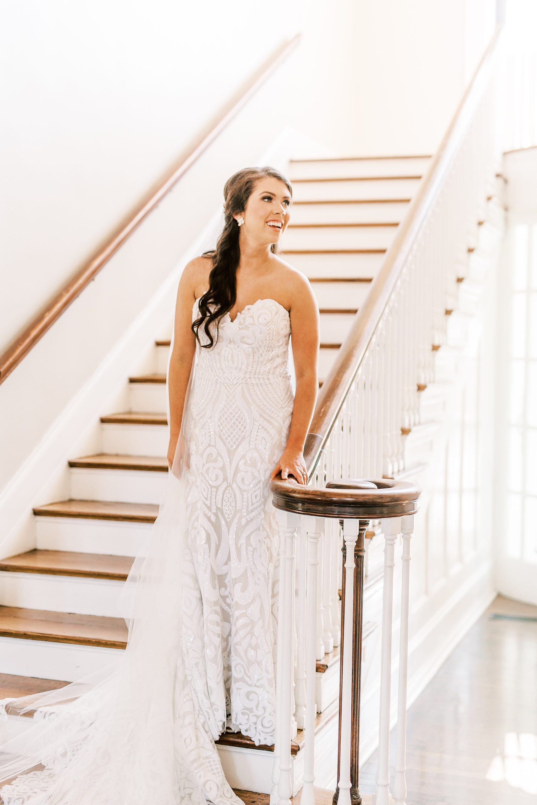 bride poses on staircase at Separk Mansion