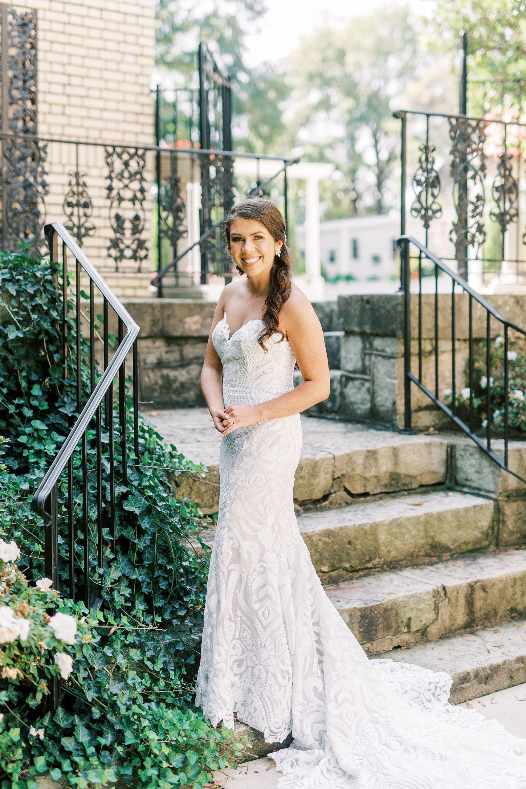 bride poses by steps at Separk Mansion