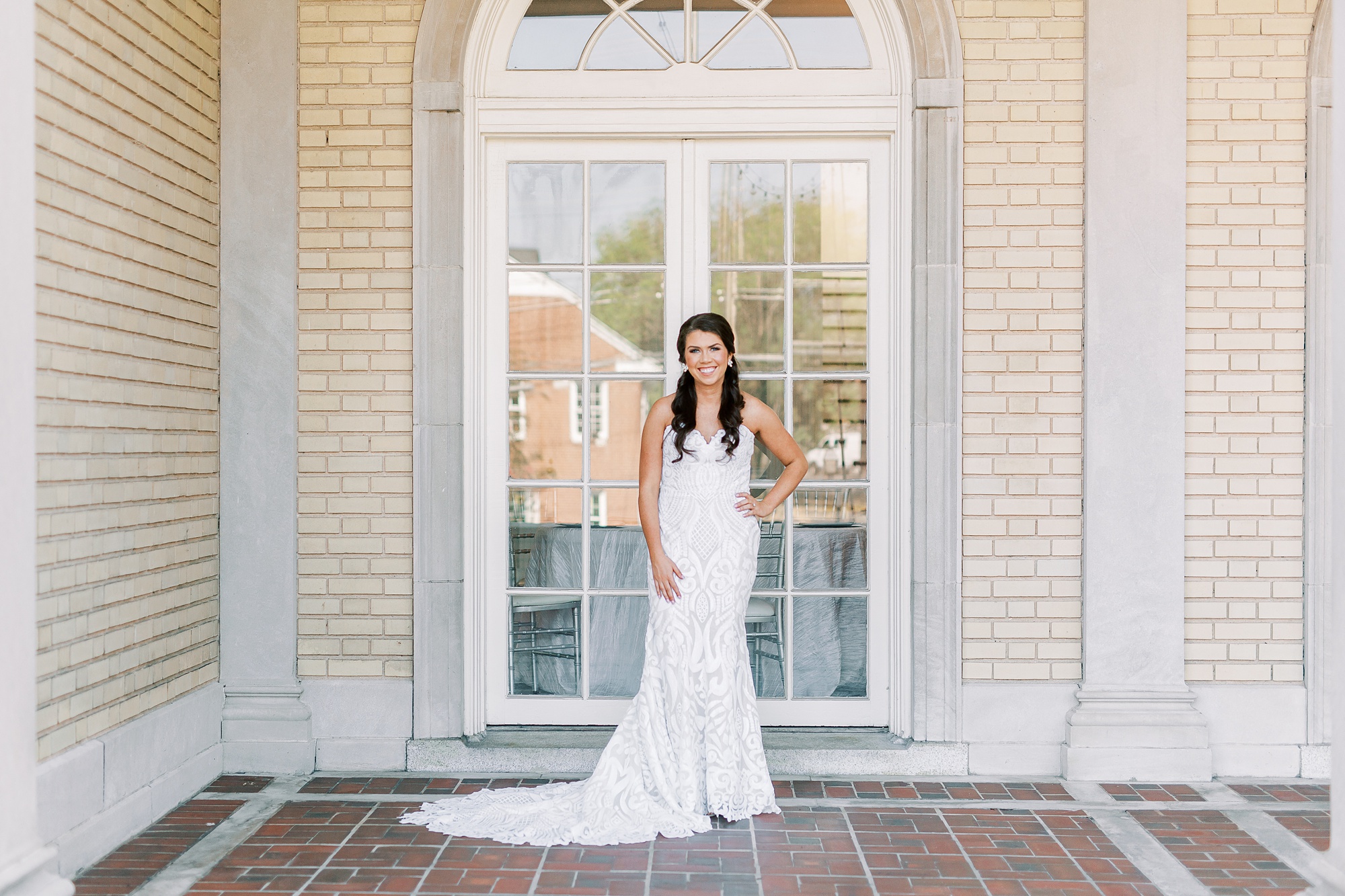 bride stands outside patio door at Separk Mansion