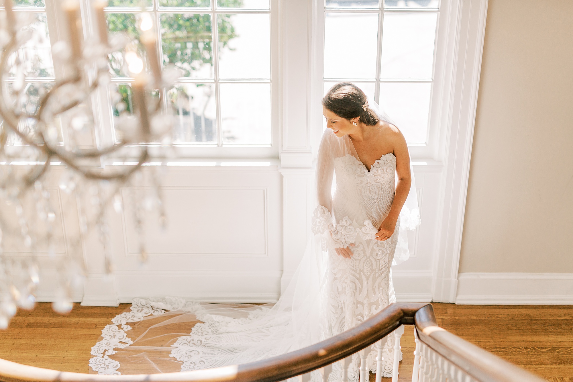 bride stands by staircase in Separk Mansion