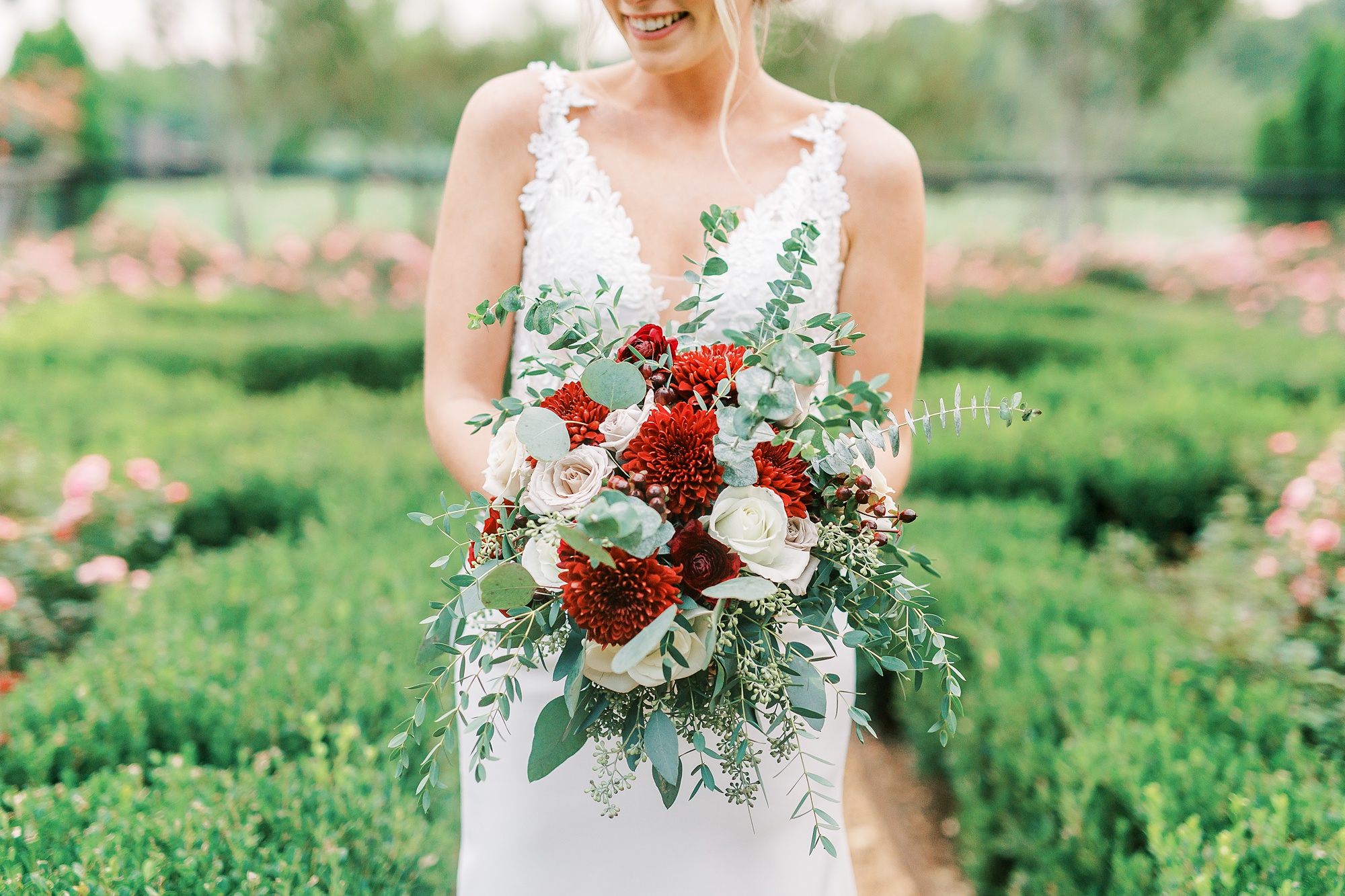 bride holds bouquet of fall flowers