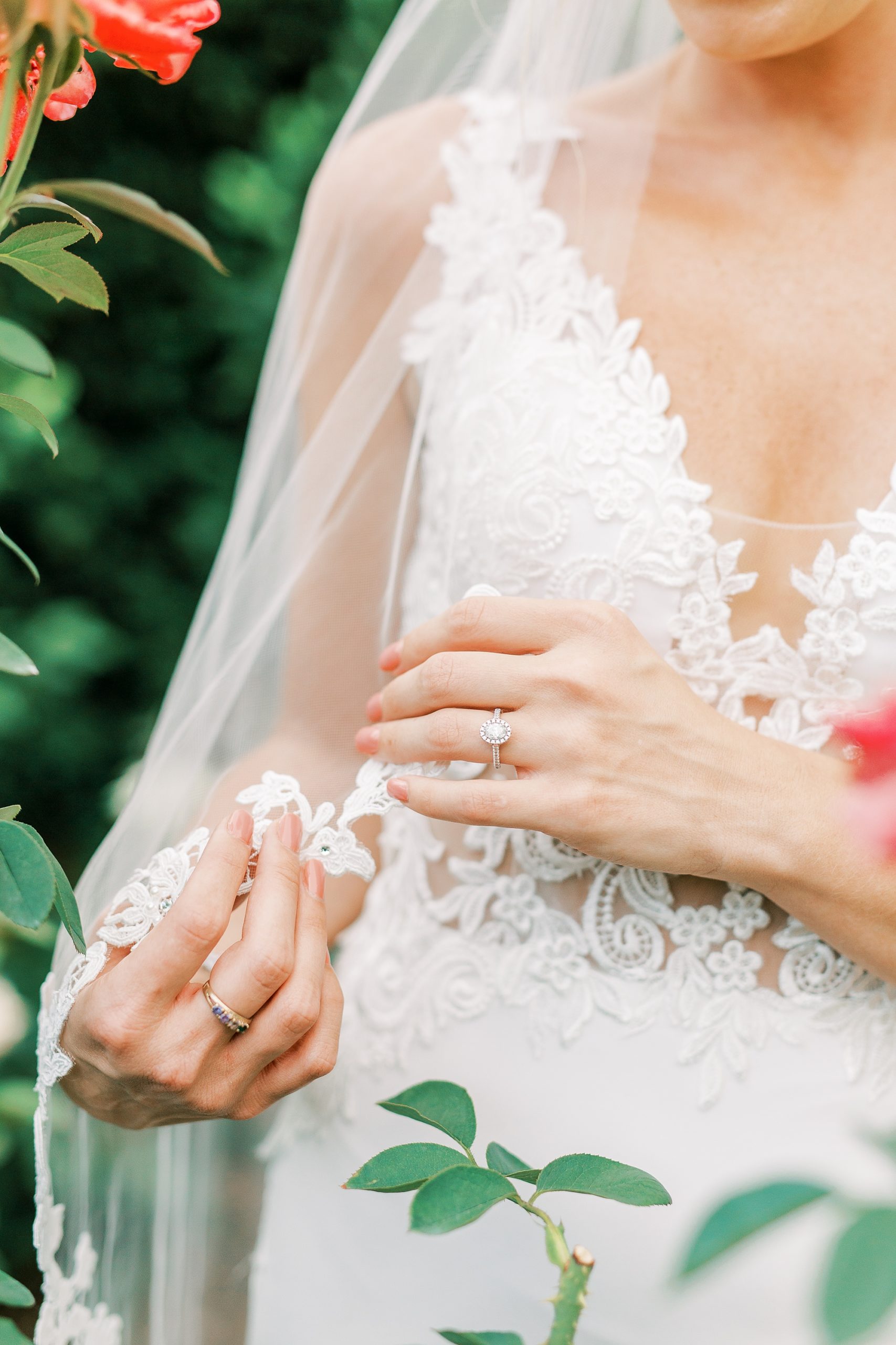 bride shows off engagement ring during bridal portraits