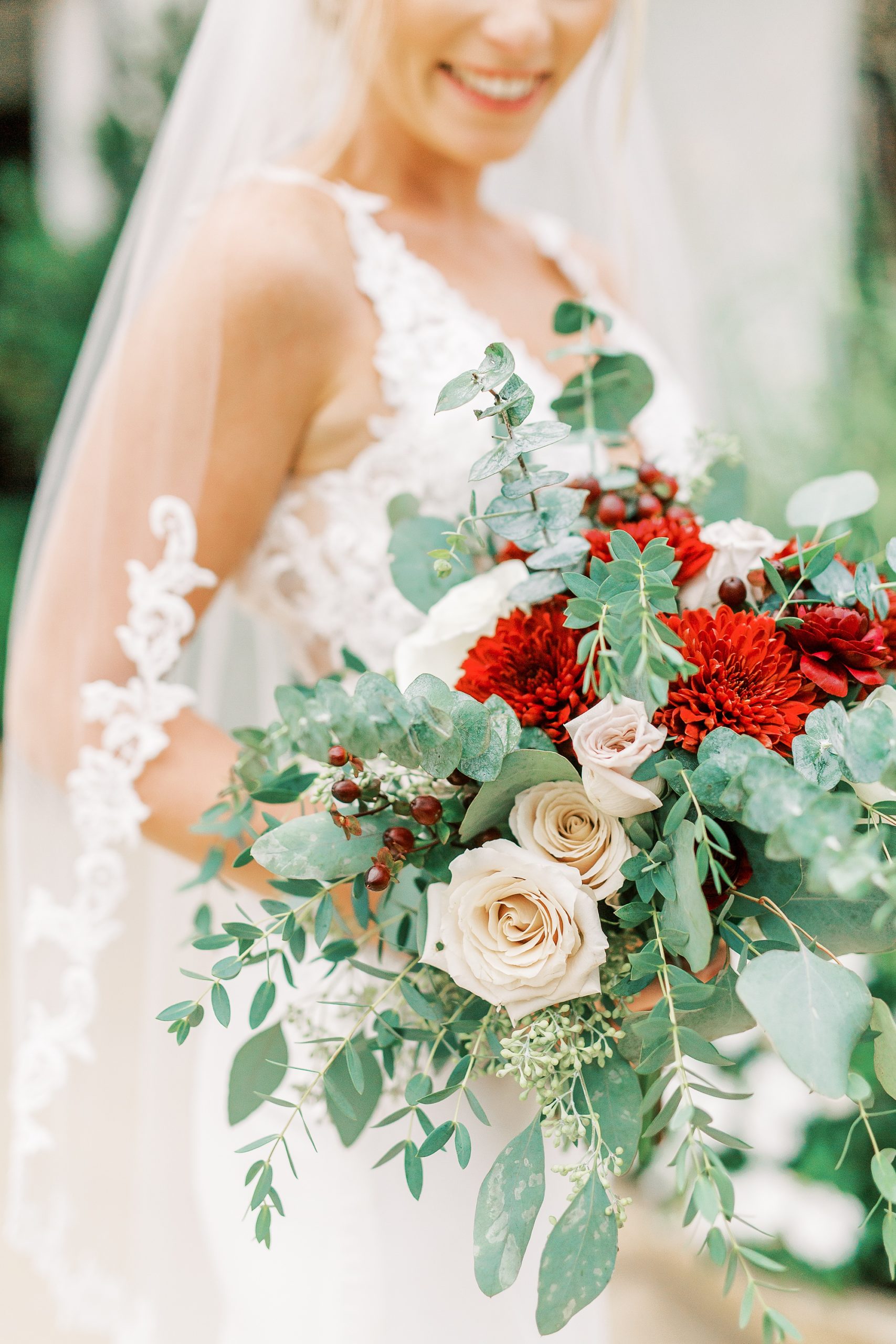 bride holds bouquet of flowers