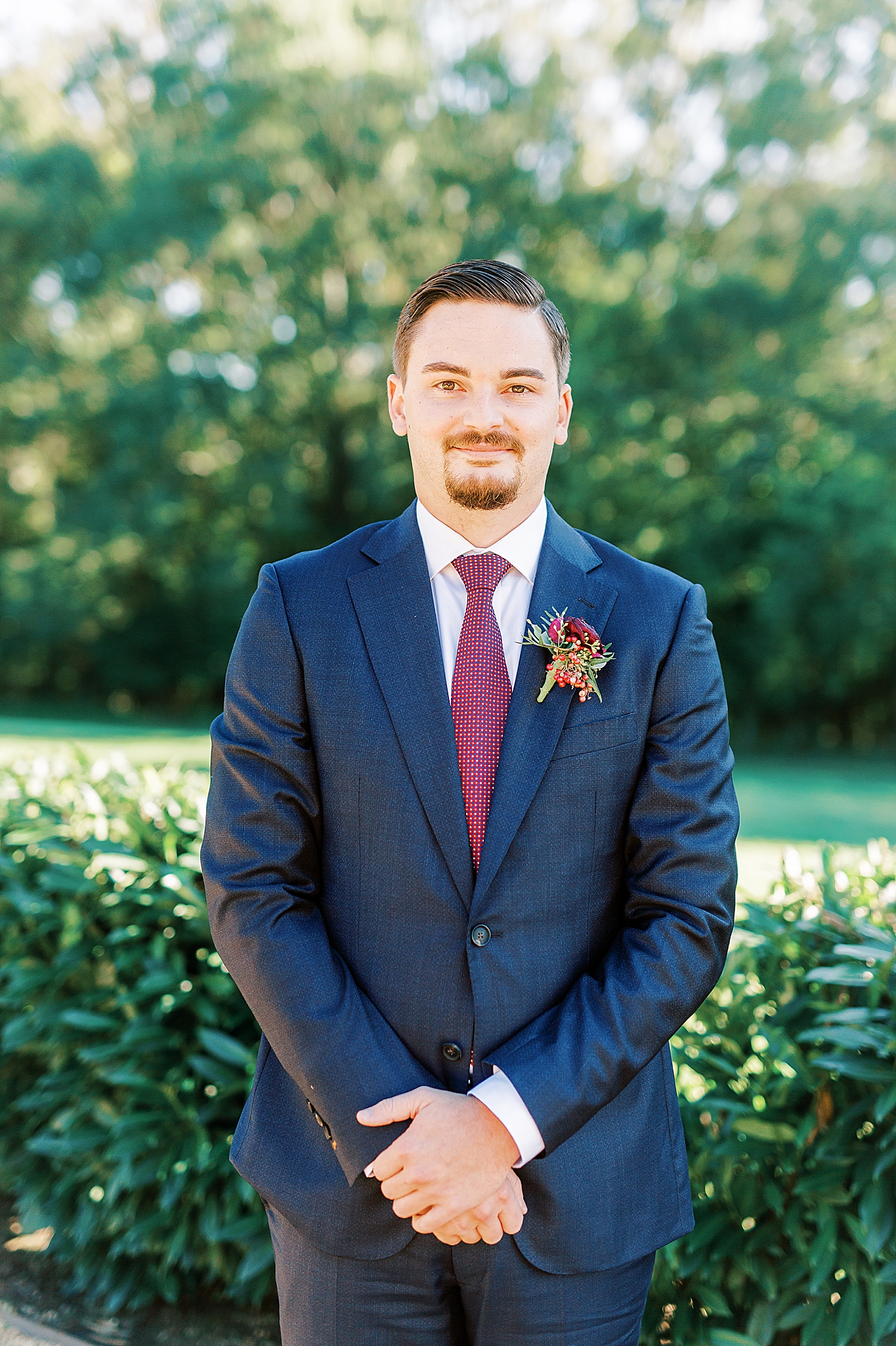 groom prepares for fall wedding day