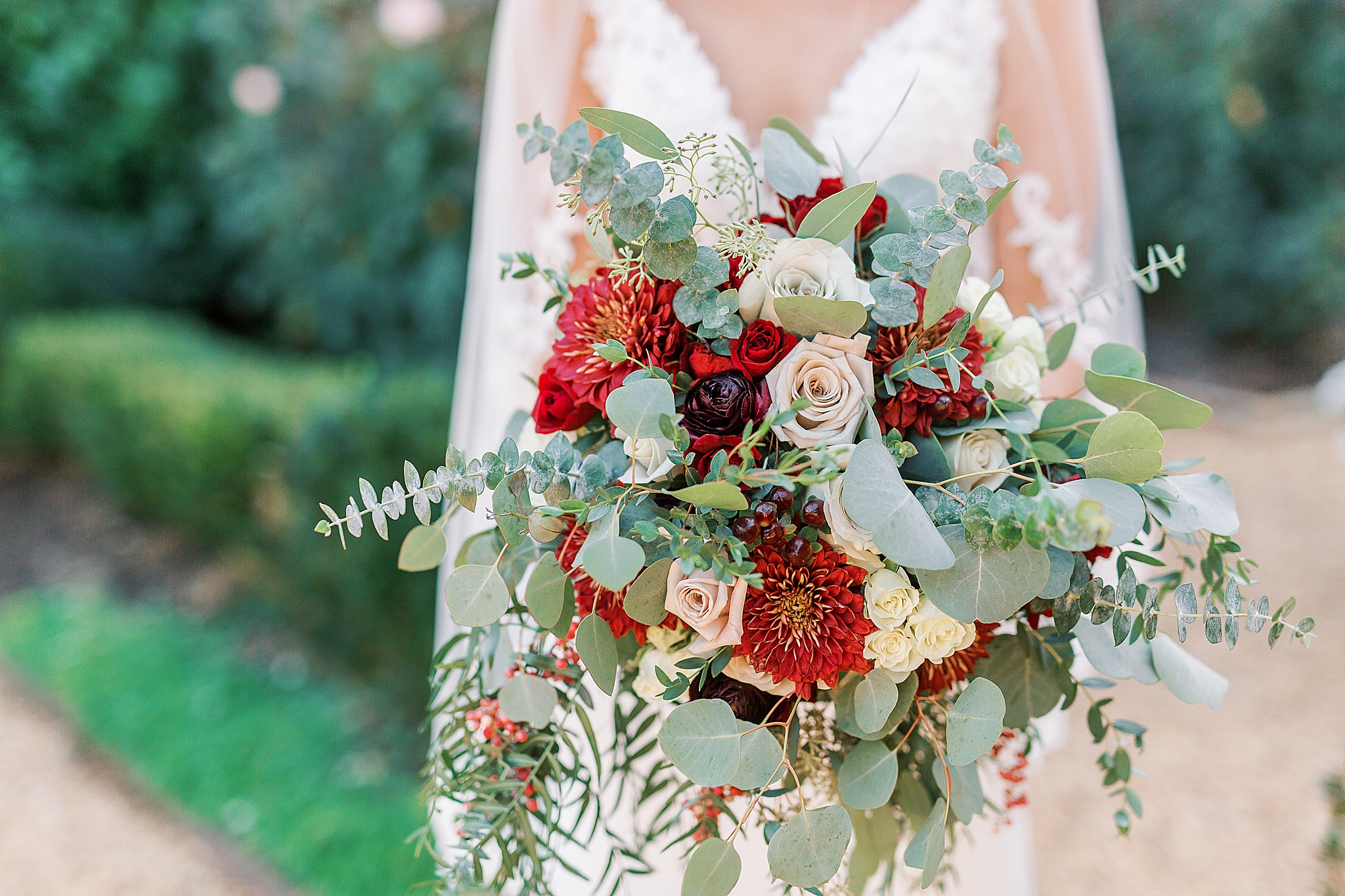 fall bouquet with red and ivory flowers