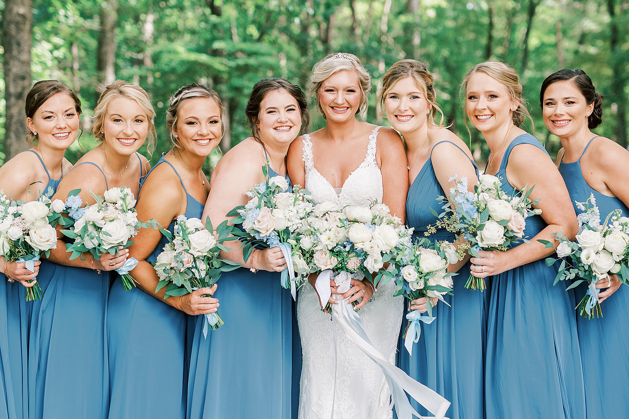 NC bride poses with bridesmaids in robin's blue gowns
