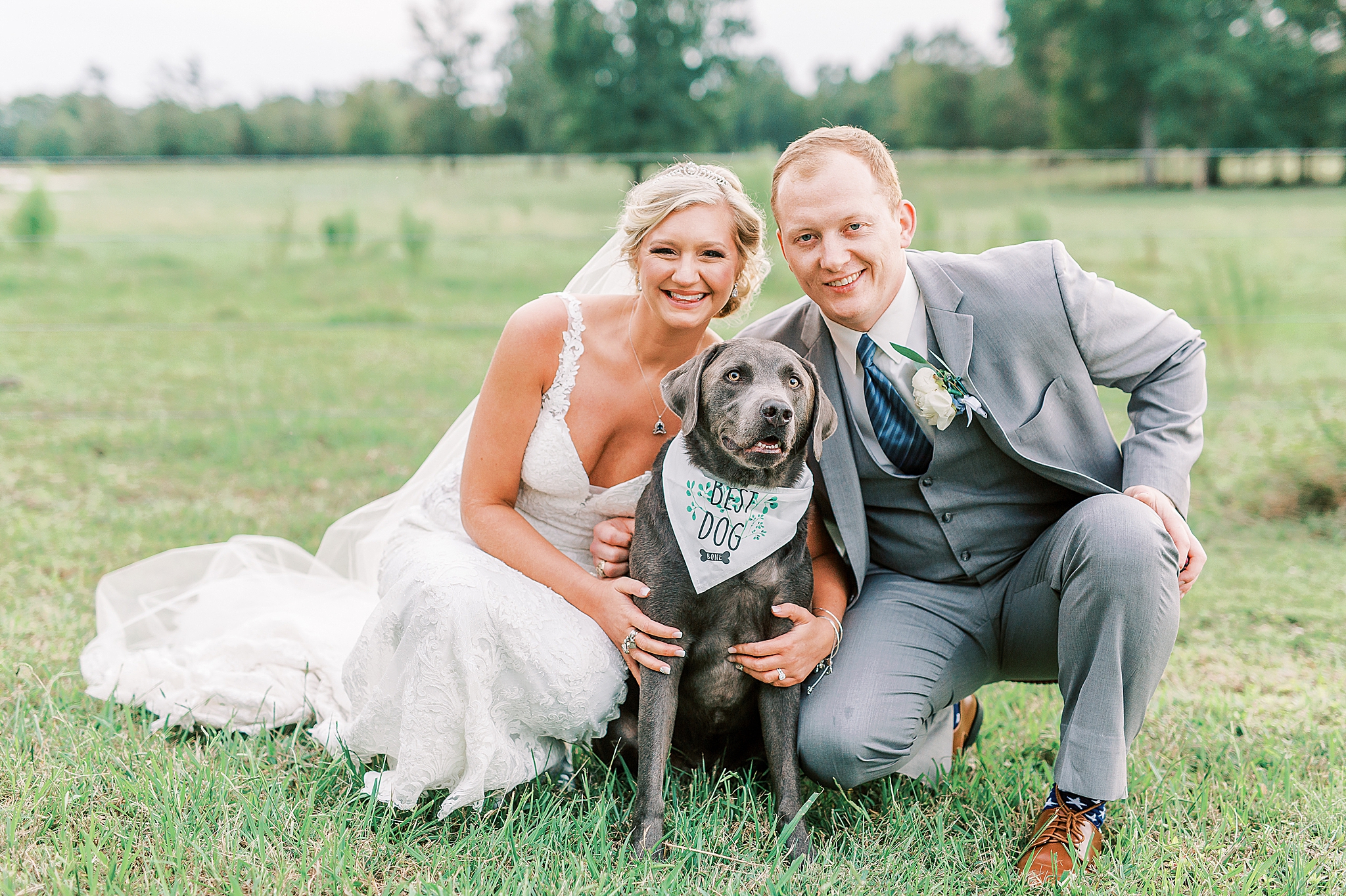 bride and groom pose with dog during NC wedding photos