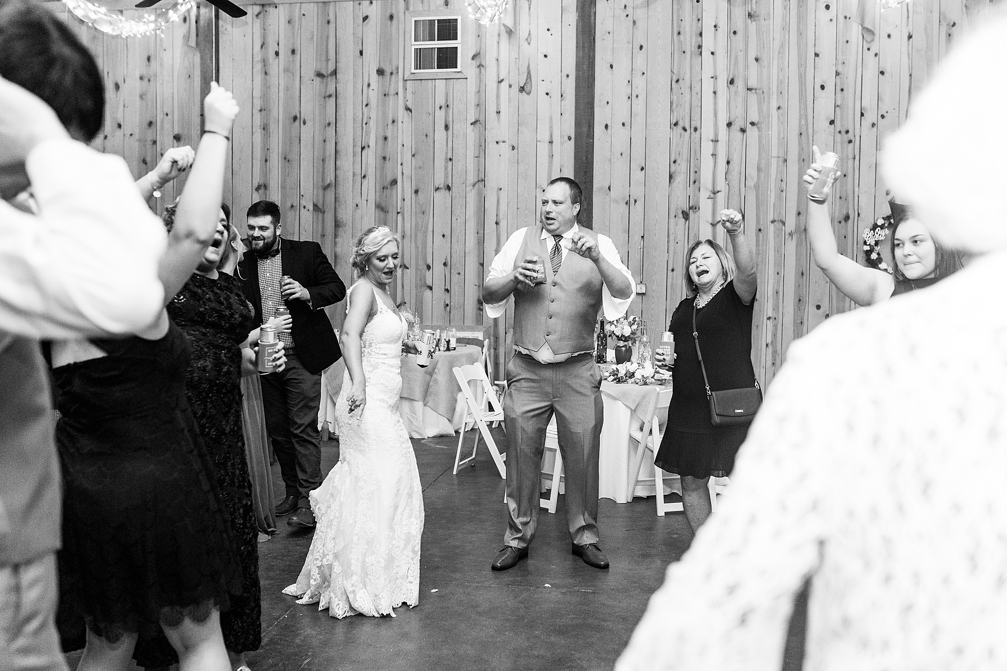 bride and groom dance with wedding guests in North Carolina