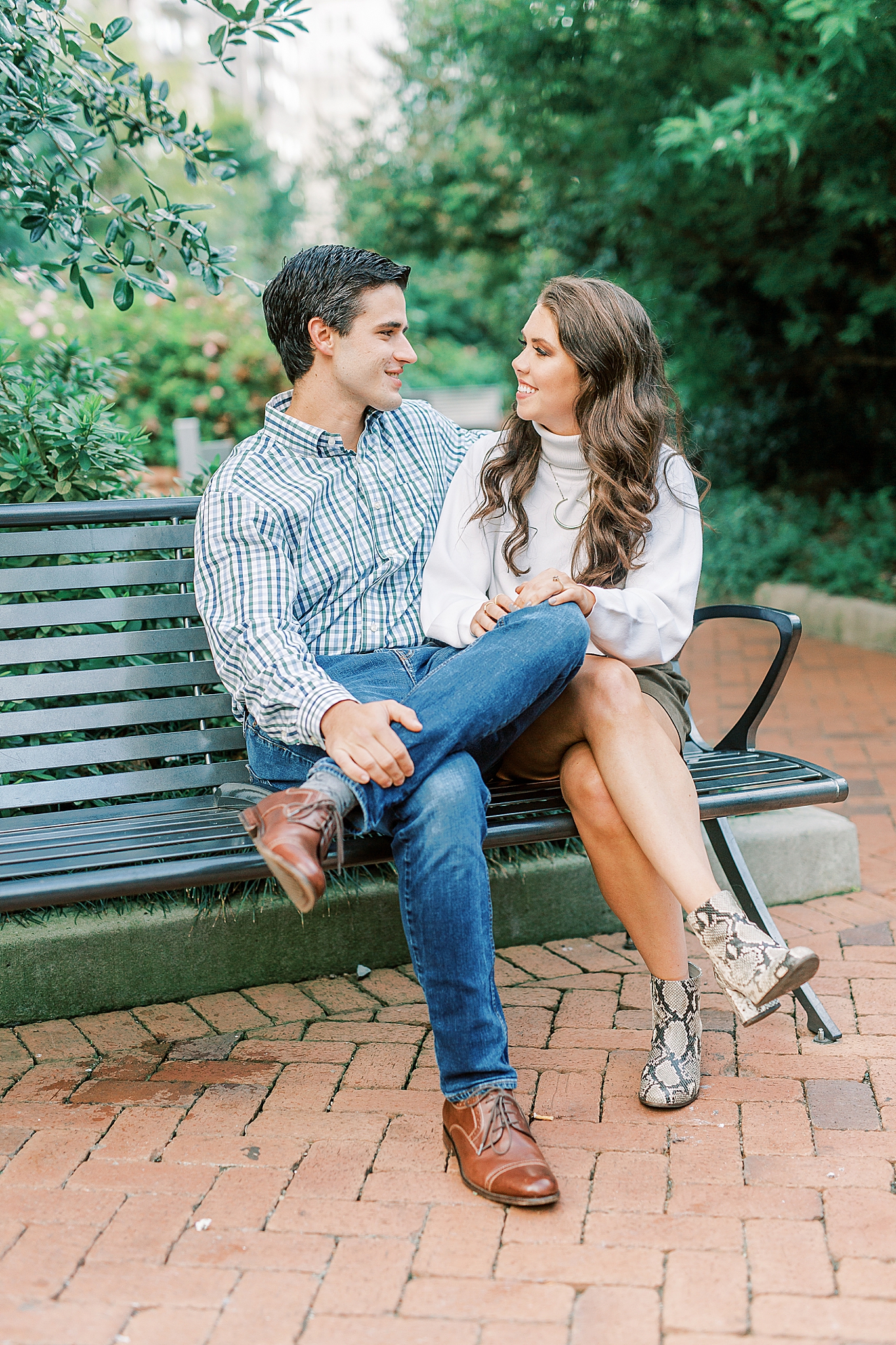 engaged couple laughs during NC engagement session