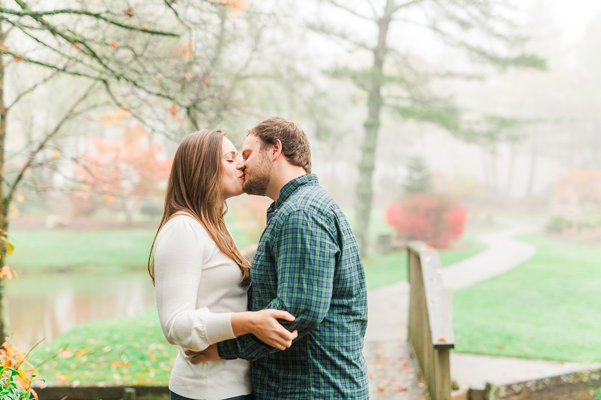 couple kisses during NC engagement portraits