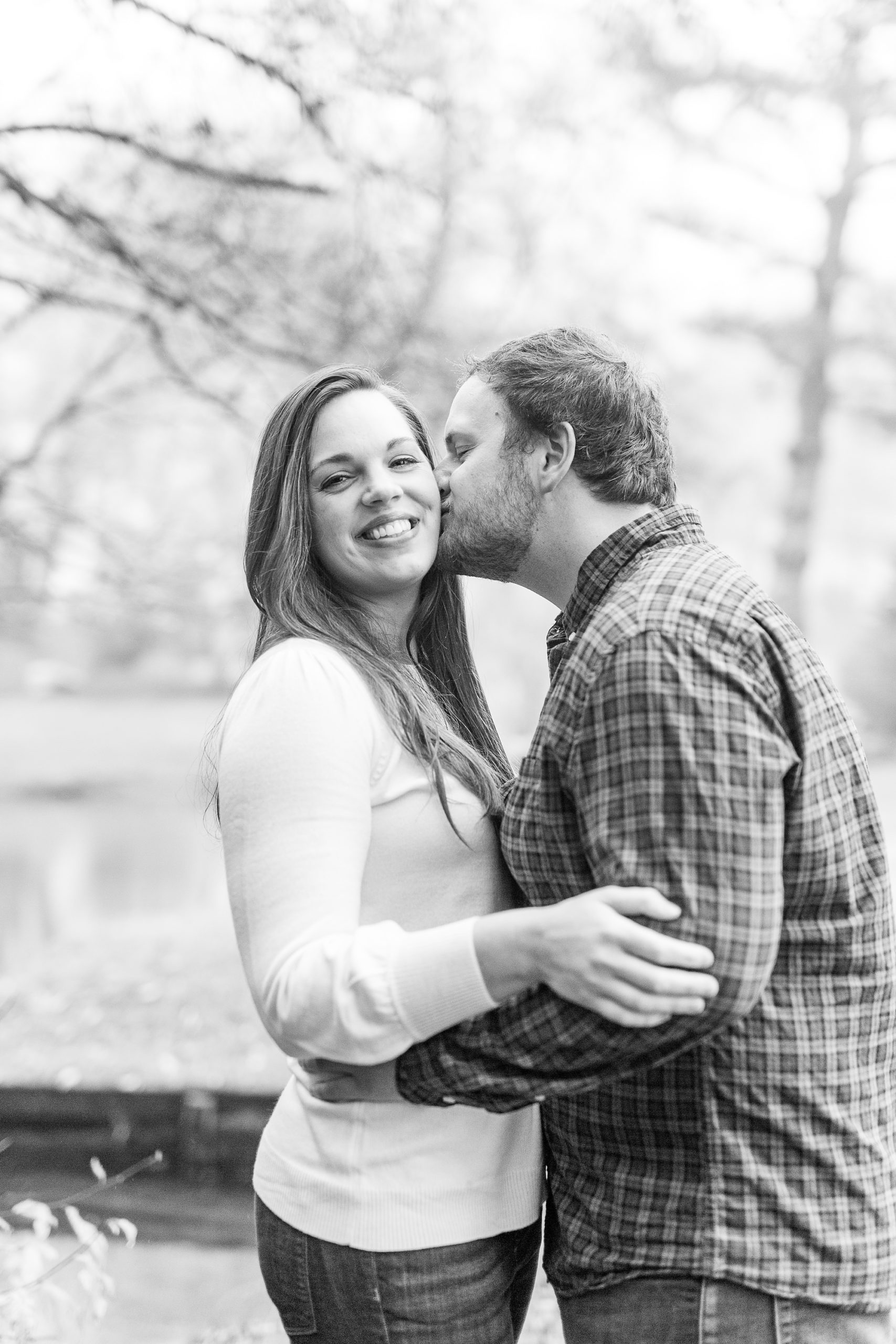 groom kisses bride during Blowing Rock engagement session