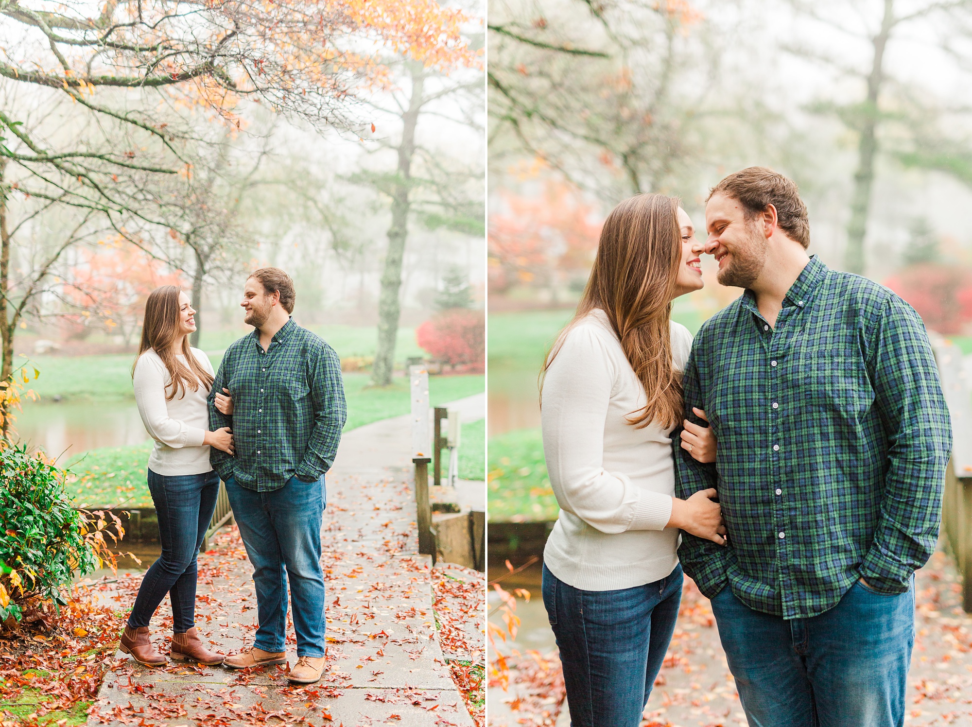 couple kisses on path during fall engagement portraits