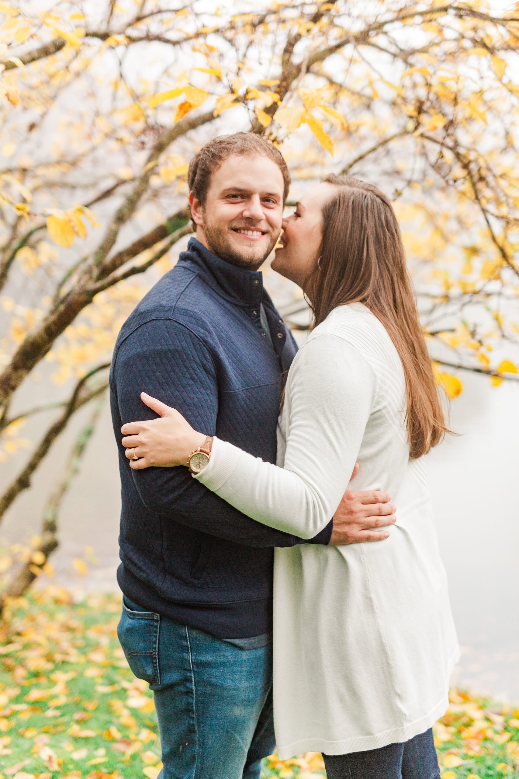 bride laughs with groom during Blowing Rock engagement photos