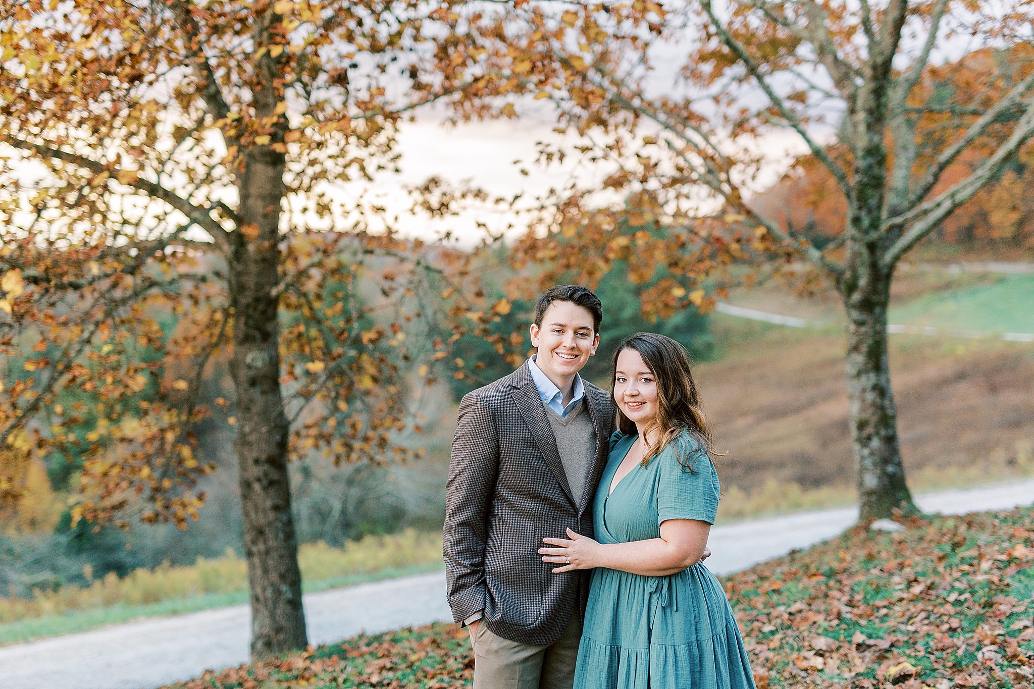 fall engagement portraits under orange tree in Boone NC